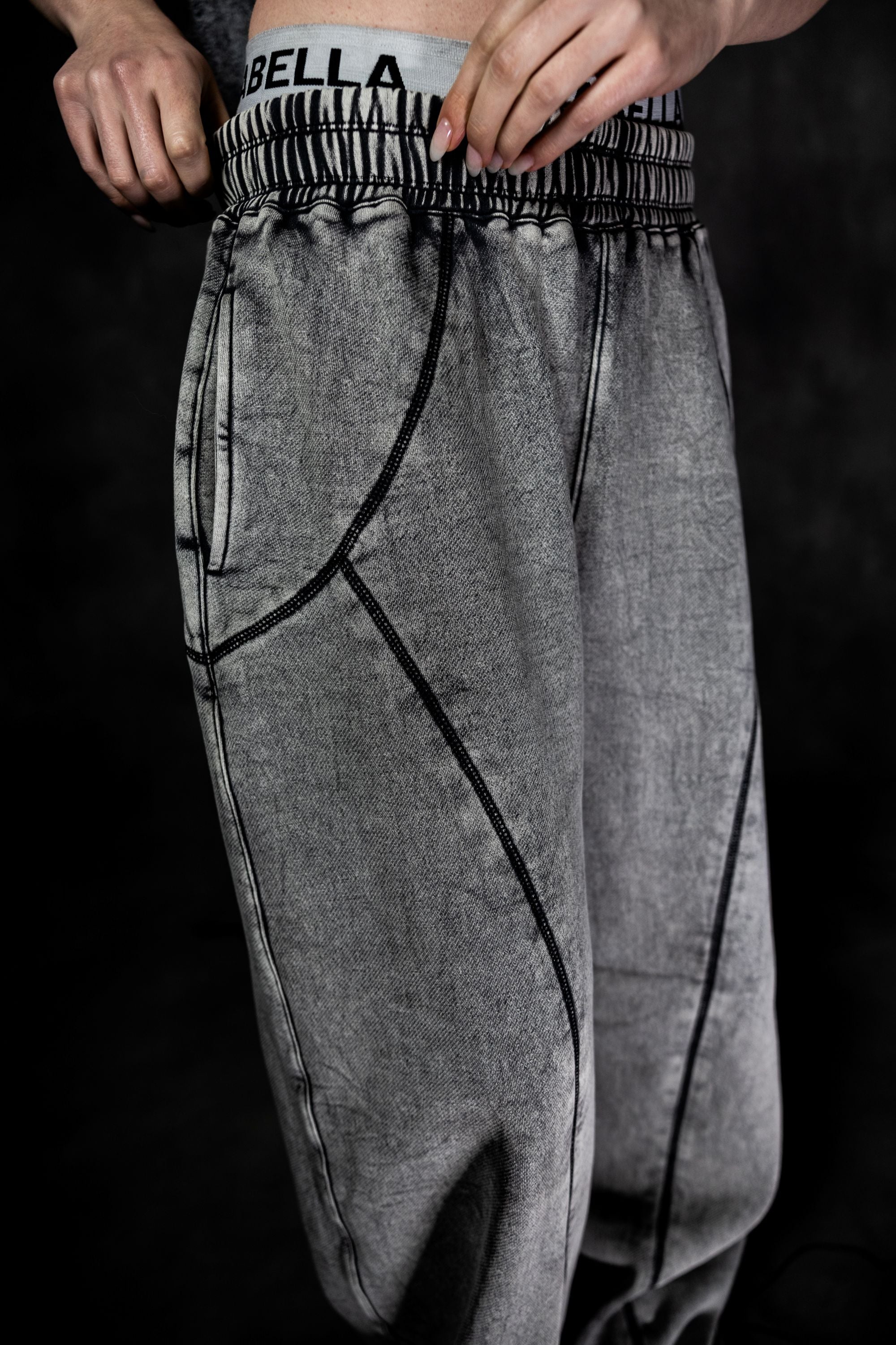 Close-up of elastic waistband on grey baggy lower highlighting comfort and flexibility