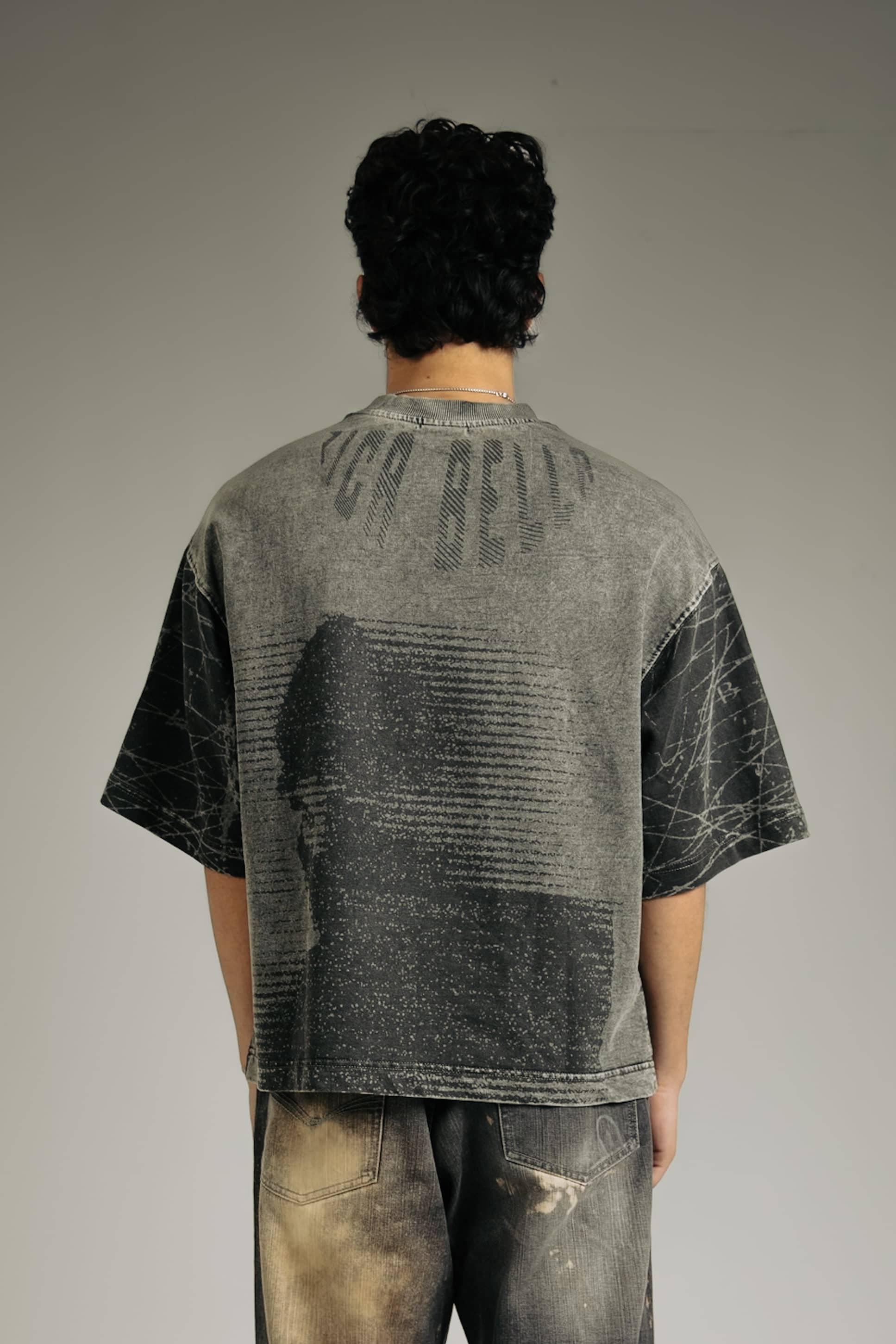 Black acid-wash t-shirt for men, stylish and edgy streetwear fashion, perfect for casual wear