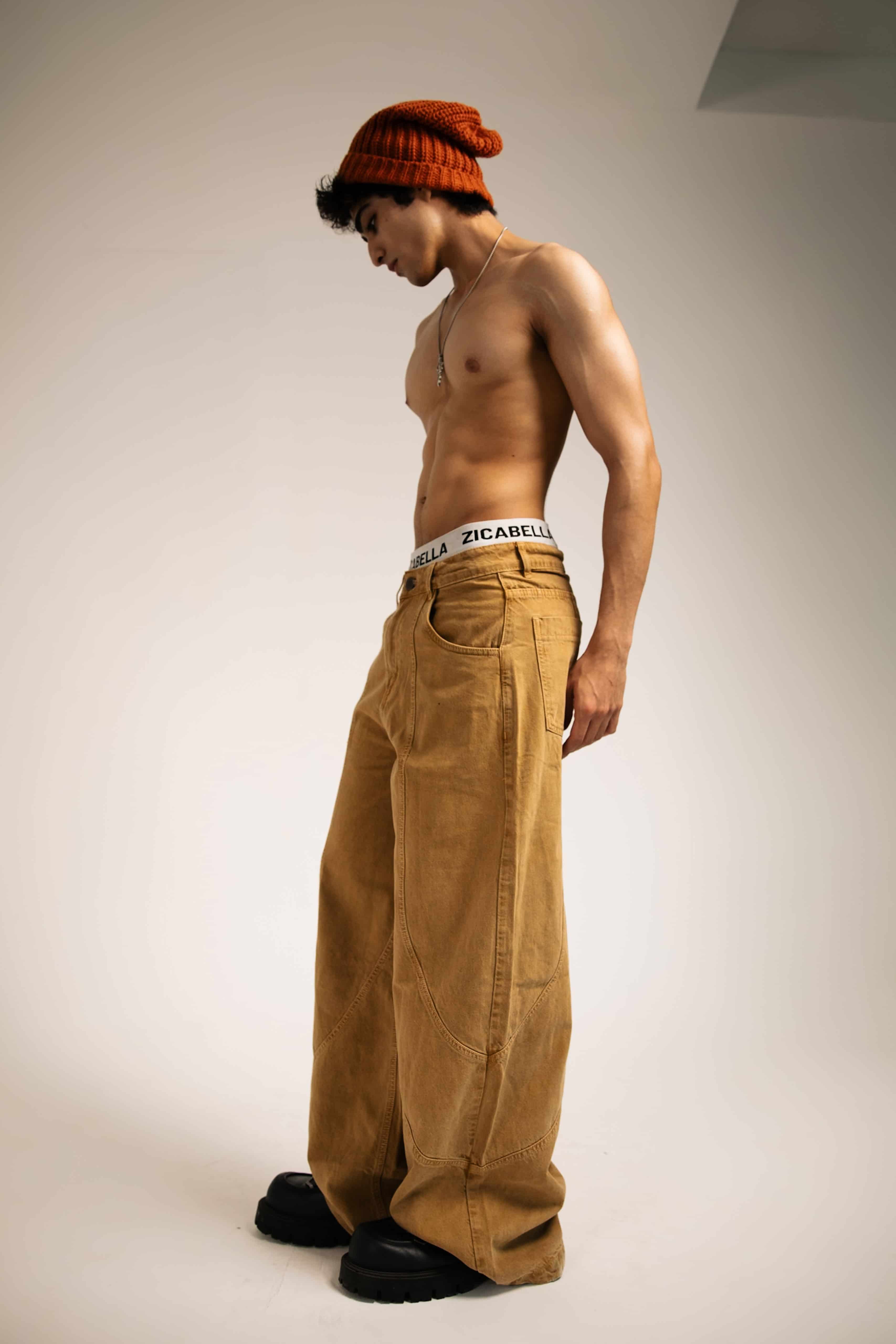 Beige cotton jeans with a relaxed fit, perfect for urban street style