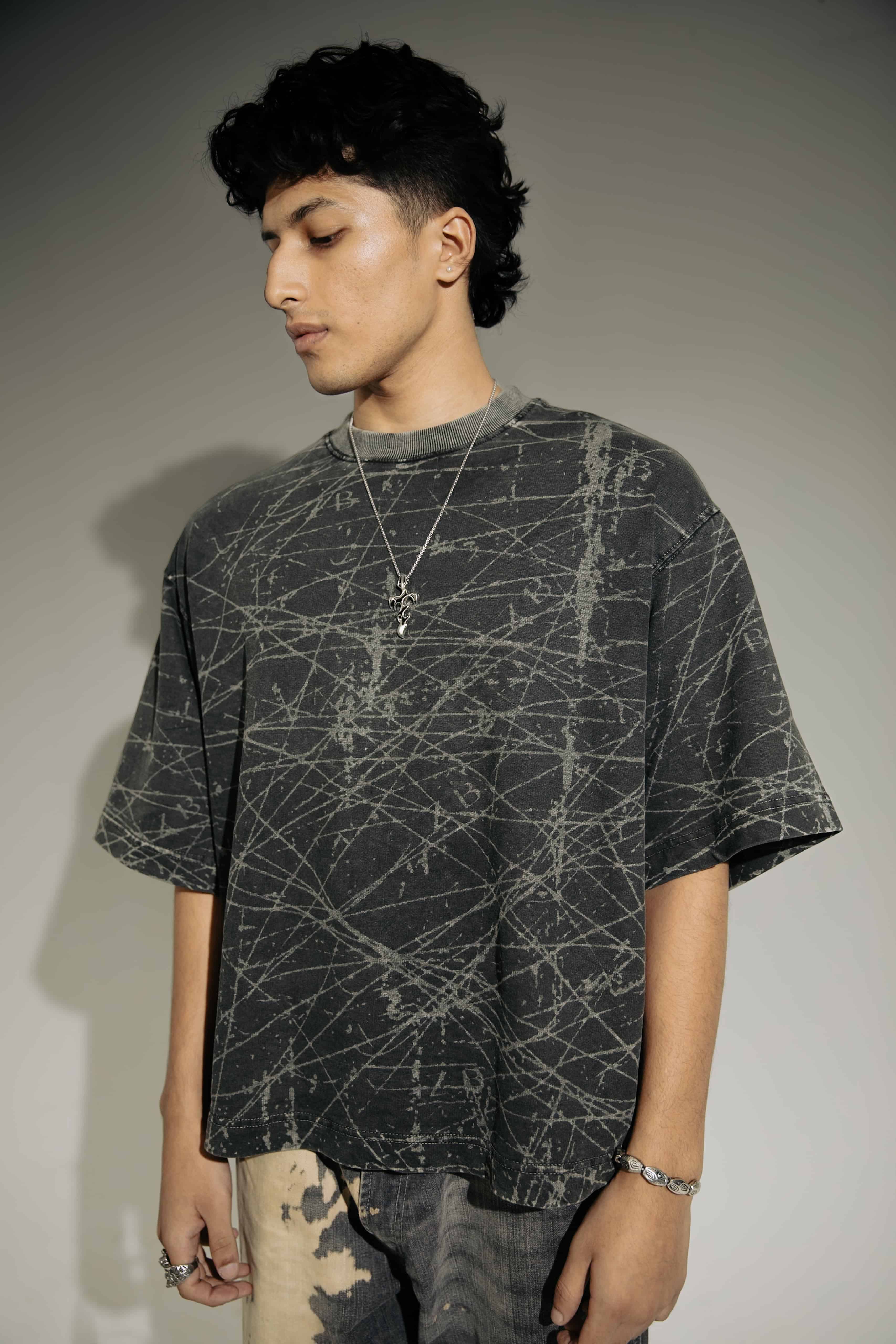 Black acid-wash oversized t-shirt for men, street style streetwear with a bold fashion statement