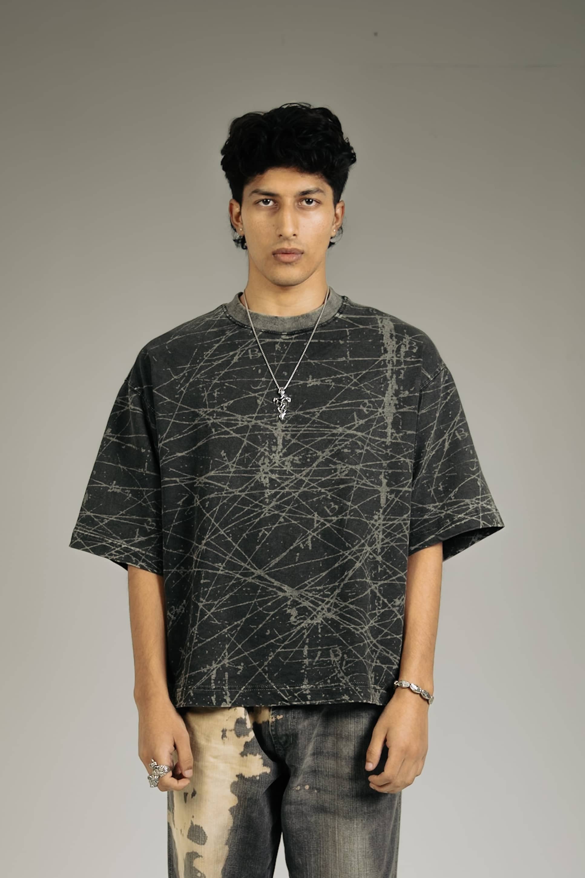 Stylish black oversized acid-wash tee for men, perfect for streetwear fashion lovers