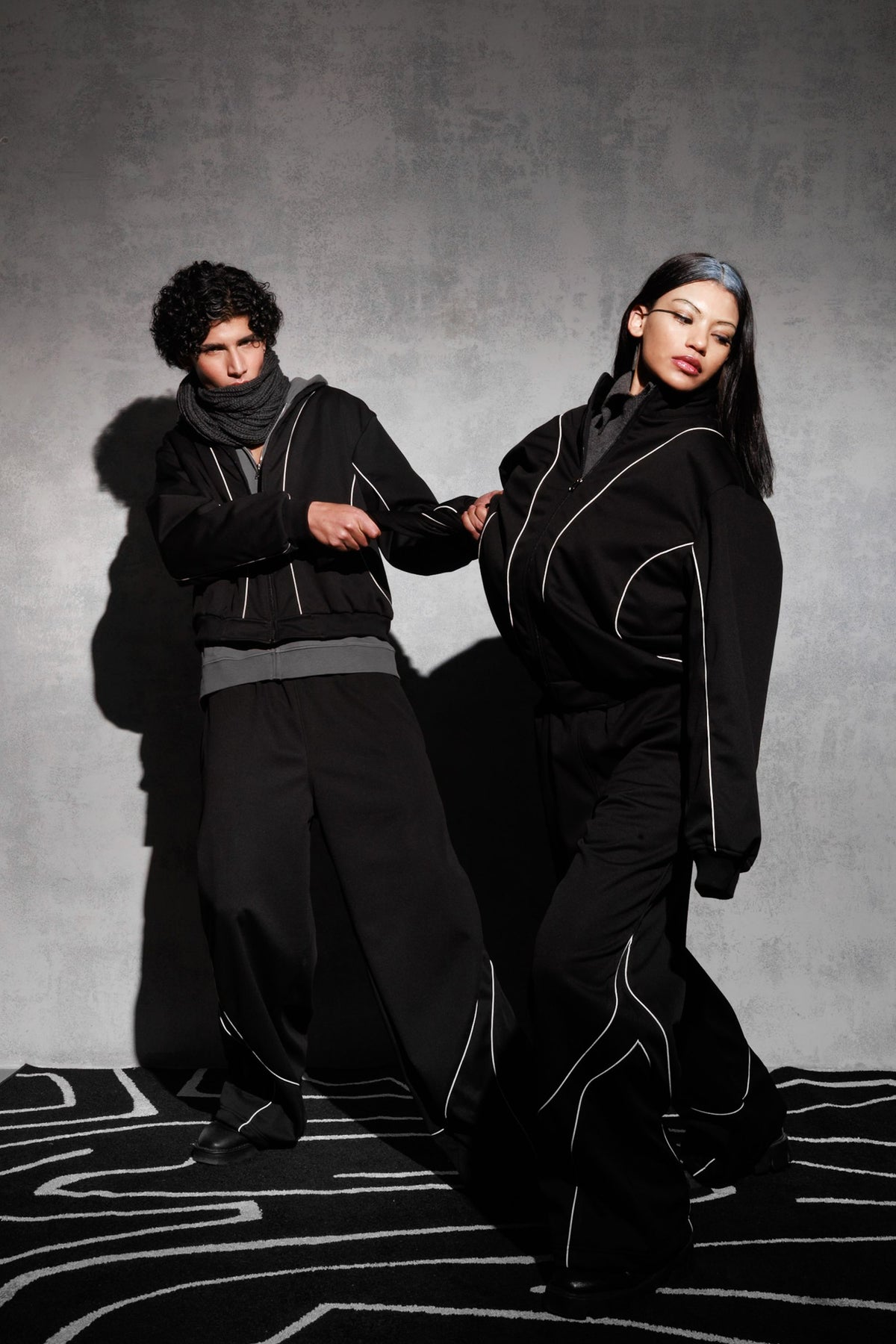 Black oversized tracksuit styled as contemporary streetwear outfi