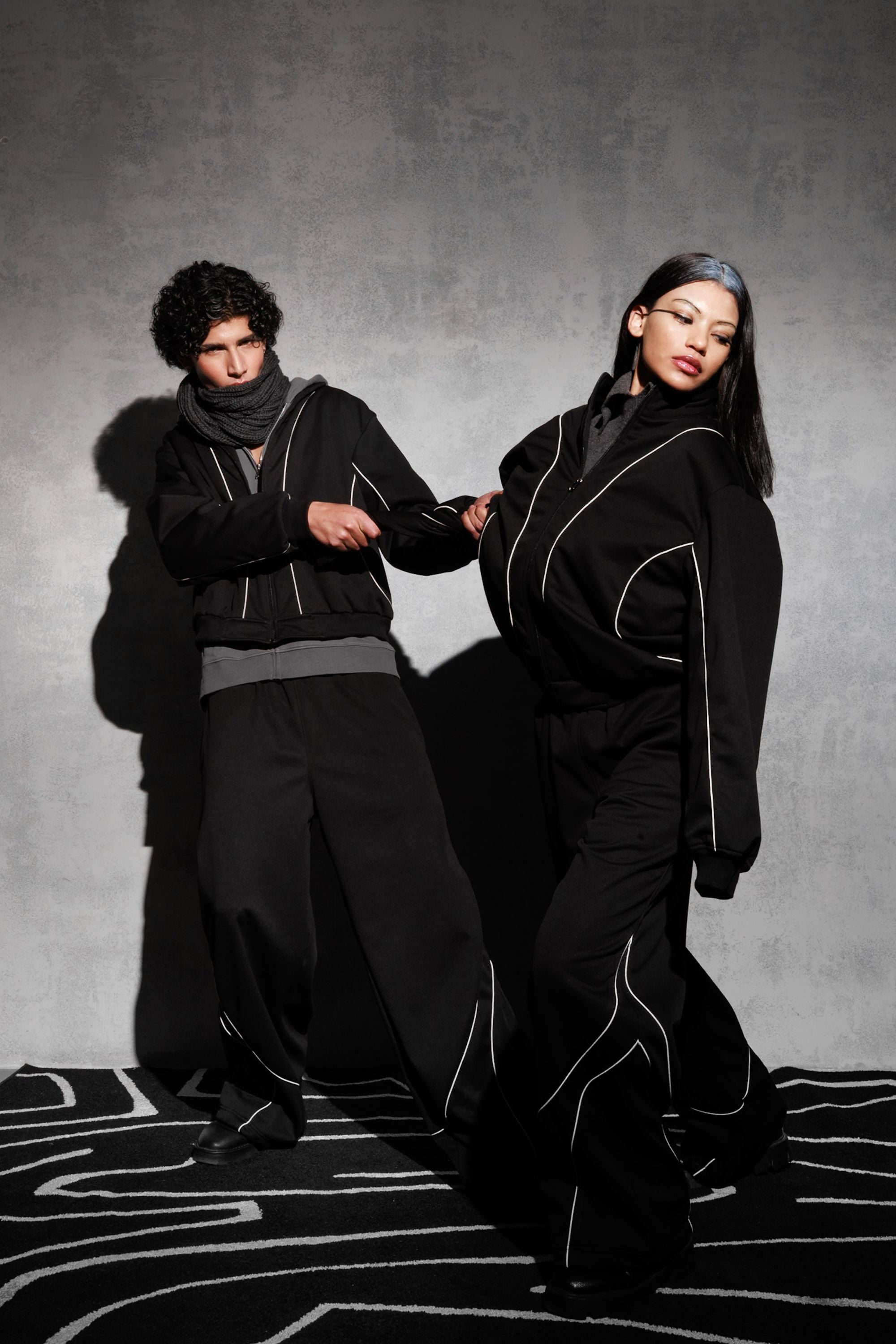 Black oversized tracksuit styled as contemporary streetwear outfi