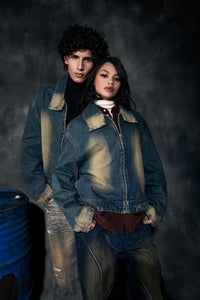 Blue oversized denim jacket with distressed finish for modern streetwear fashion