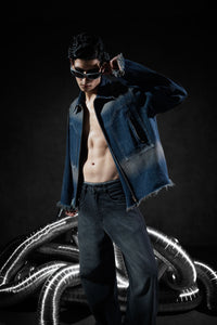 blue denim jacket with zipper closure and raw edge detailing in a casual fit