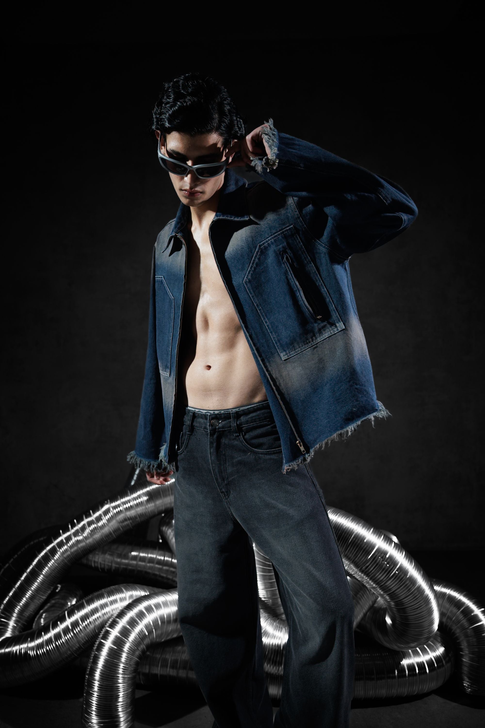 blue denim jacket with zipper closure and raw edge detailing in a casual fit