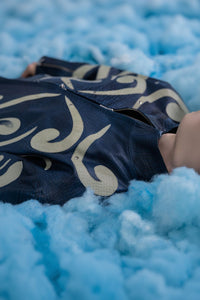 Casual shot of men's blue embossed leather jacket with beige appliqué