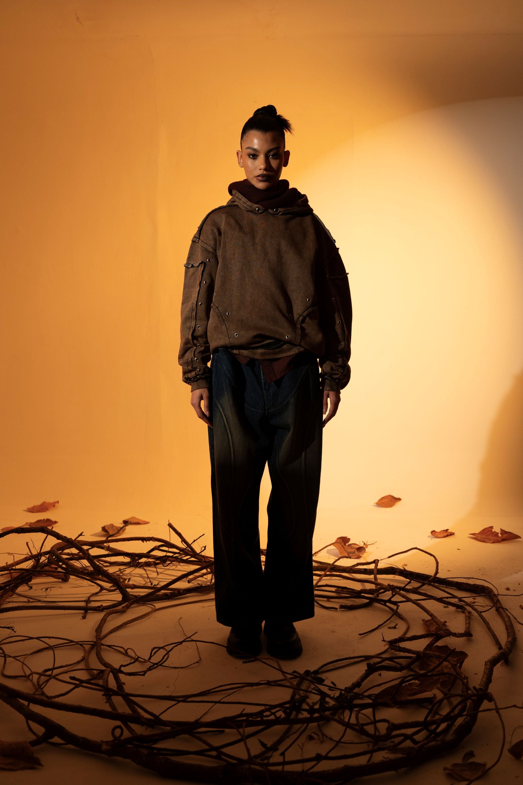 Brown cotton fleece hoodie with raw edges, offering a relaxed fit ideal for layering in cooler weather