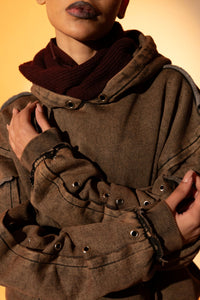 Brown cotton fleece hoodie with raw edge hem, designed for a comfortable, relaxed silhouette