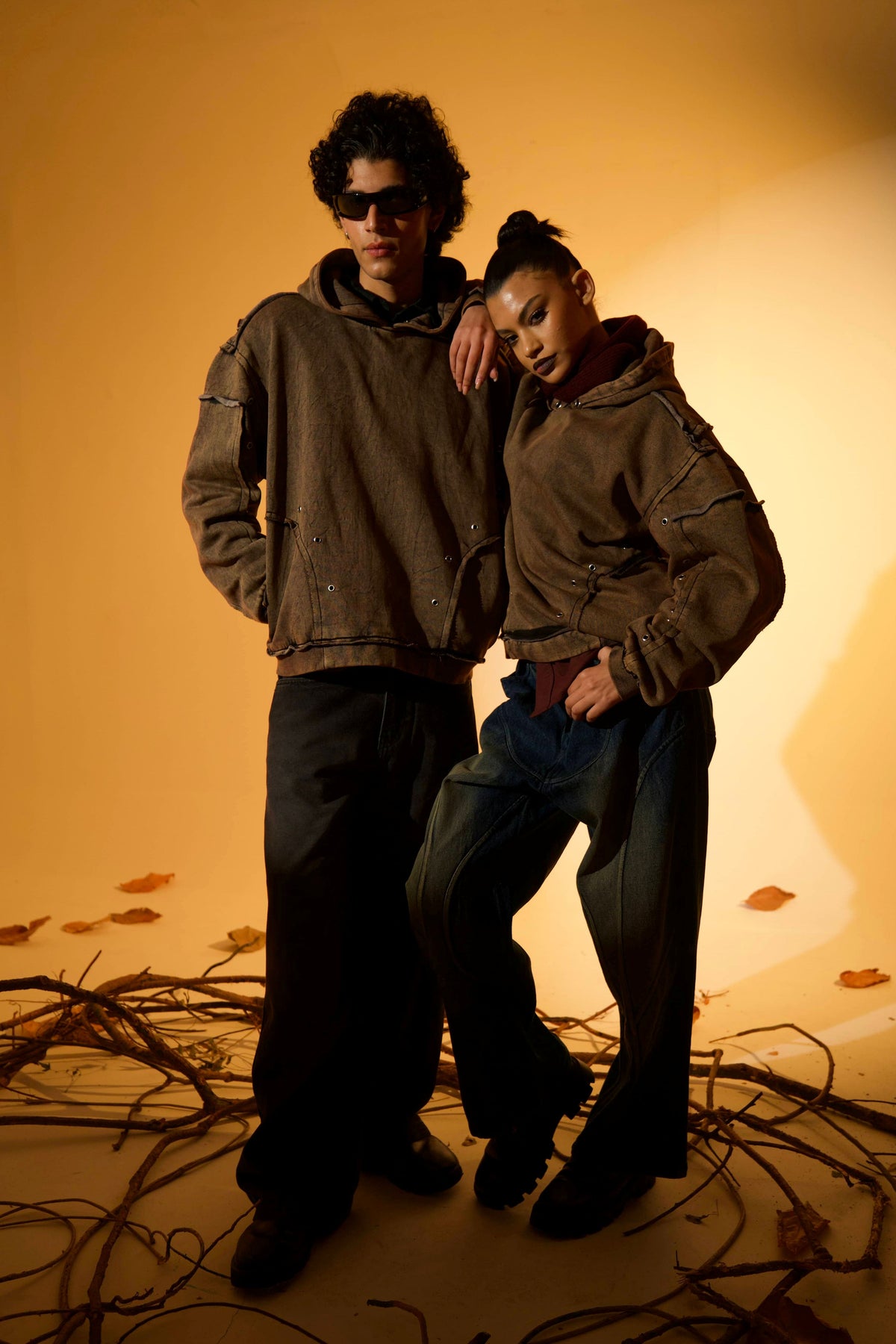 Brown oversized cotton fleece hoodie with raw edge detailing, designed for casual streetwear styling