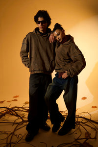 Brown oversized cotton fleece hoodie with raw edge detailing, designed for casual streetwear styling