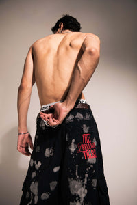 Oversized acid wash black denim cargo with loose silhouette for streetwear fashion