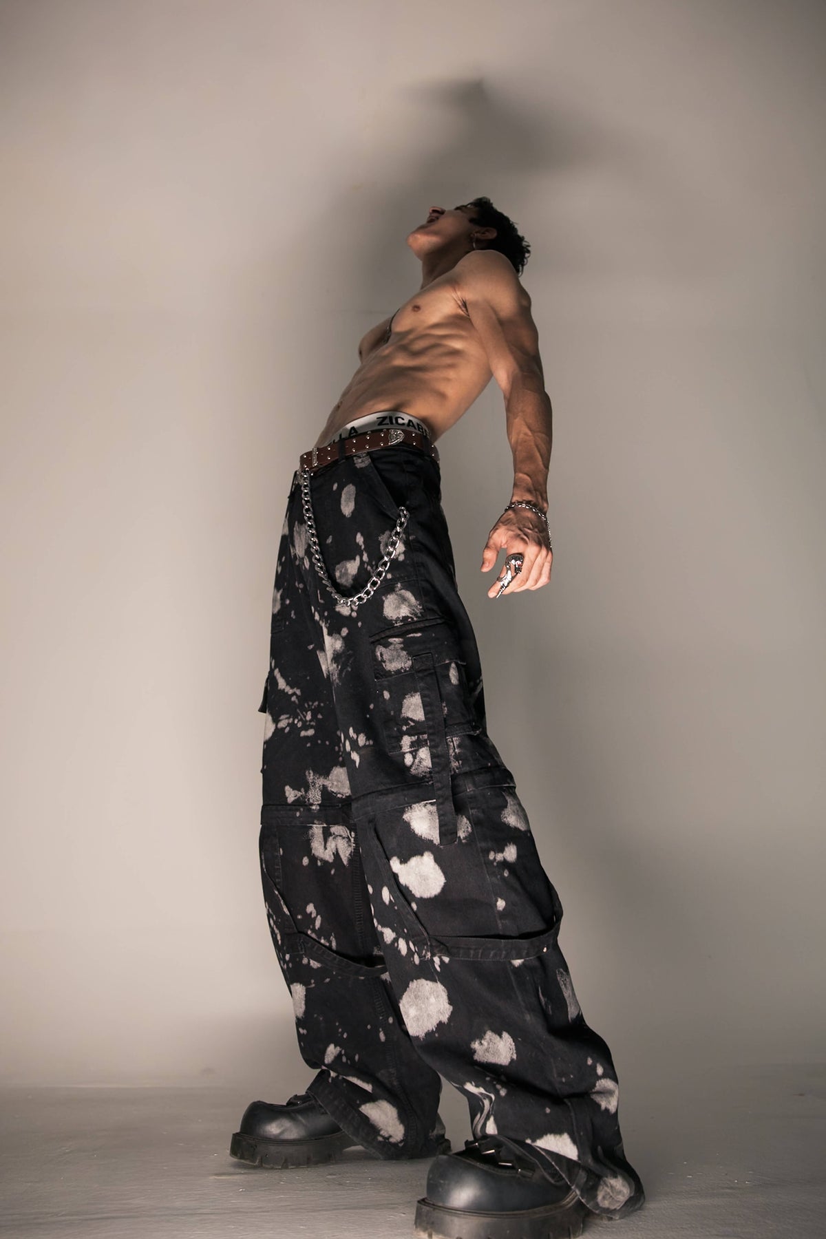 acid wash black denim cargo pants delivering raw streetwear appeal