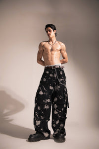 Black baggy denim cargo pants in streetwear style with relaxed oversized fit