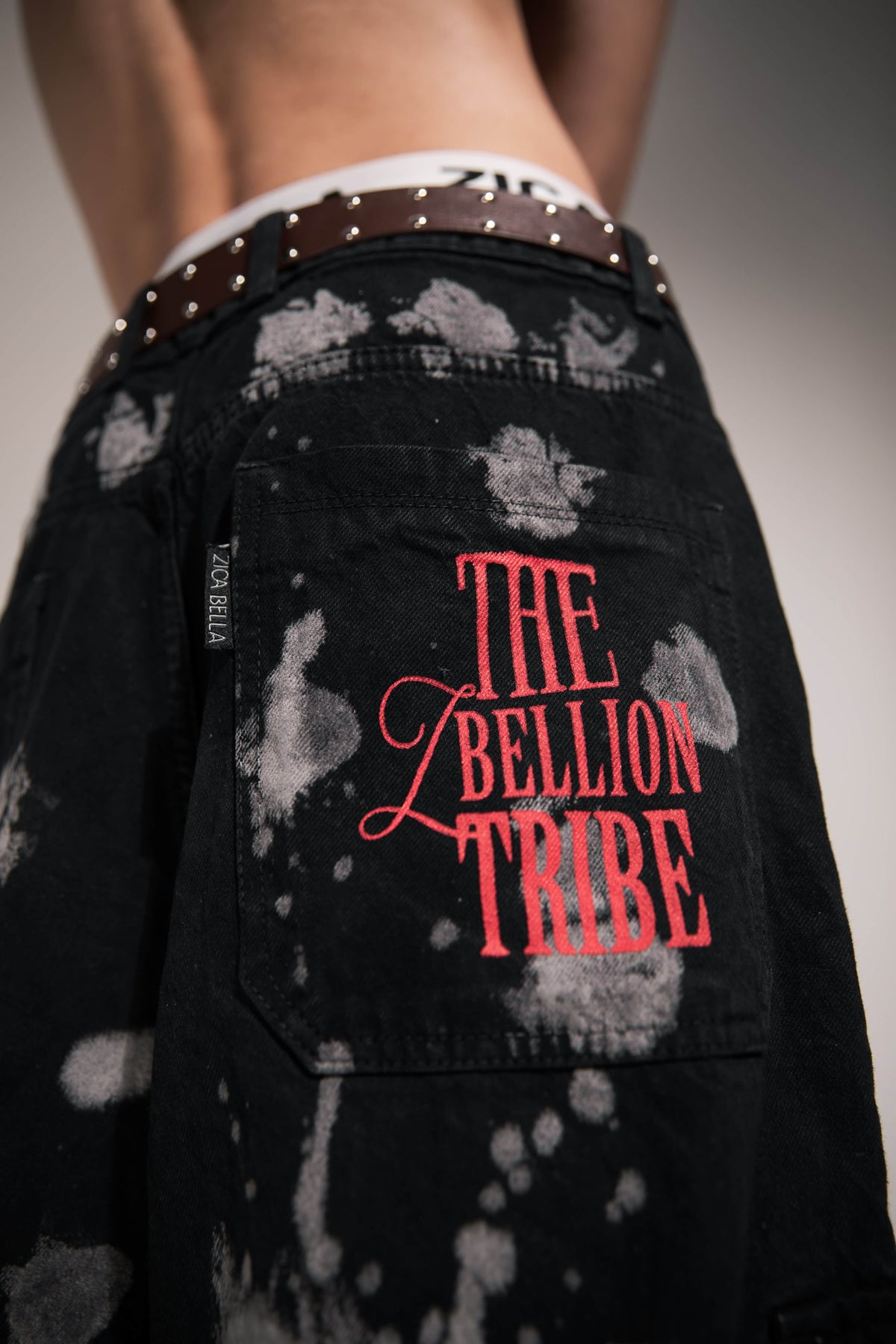 heavyweight black denim cargo pants featuring bold back print with edgy streetwear aesthetic