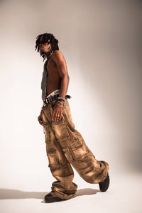 acid washed brown denim cargo pants in a baggy streetwear silhouette with structured side pockets and a heavy drape
