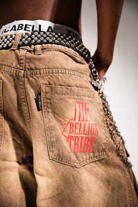 Vintage wash brown denim cargo pants with a wide leg profile and structured rear pocket detailing