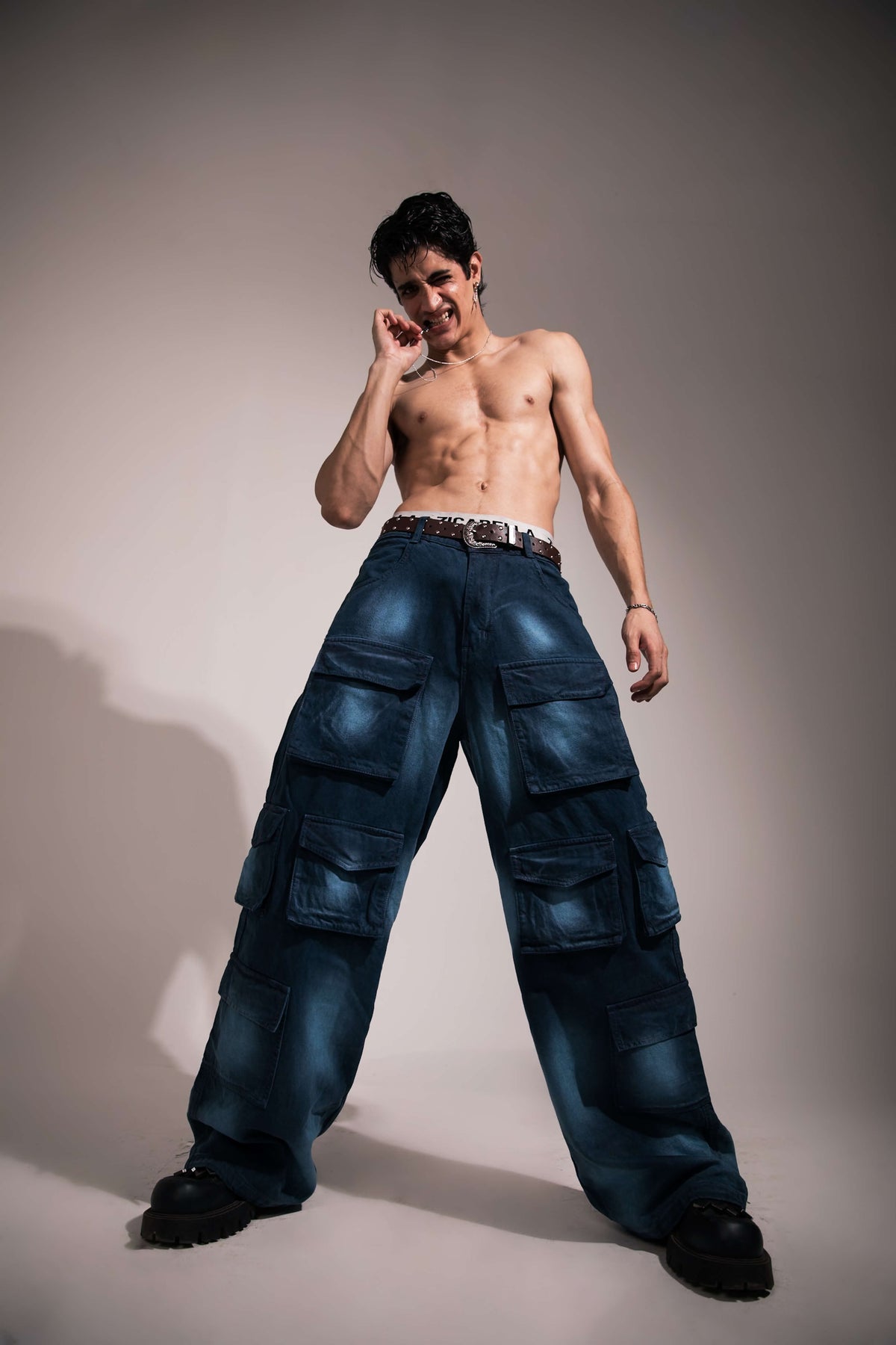 Dark blue baggy denim cargo with oversized streetwear fit and utility pocket design