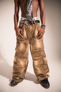 brown denim cargo pants featuring textured utility pockets and a relaxed streetwear silhouette