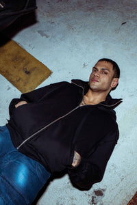 Designer black cotton hoodie with a baggy fit and a bold oversized hood, exuding premium style