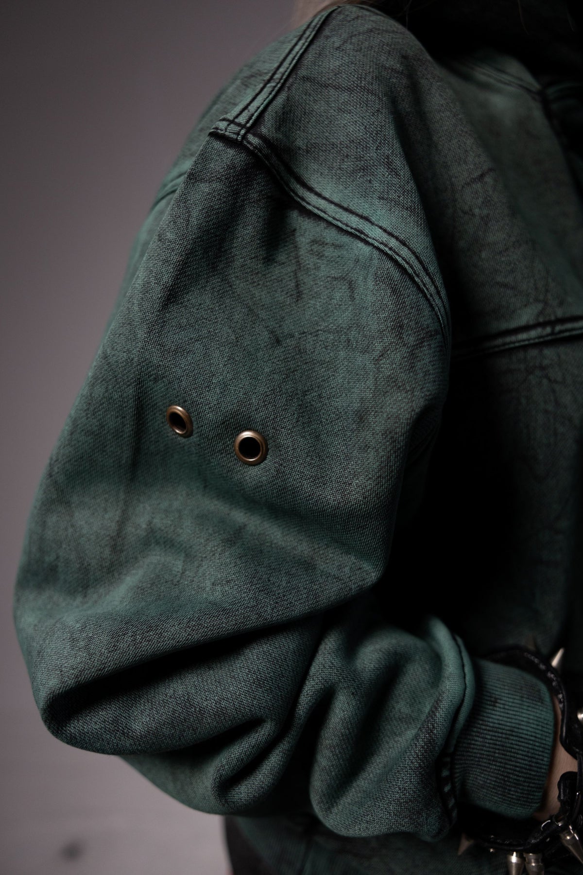 Premium fabric texture of green hoodie with soft finish and durable material