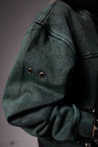 Premium fabric texture of green hoodie with soft finish and durable material