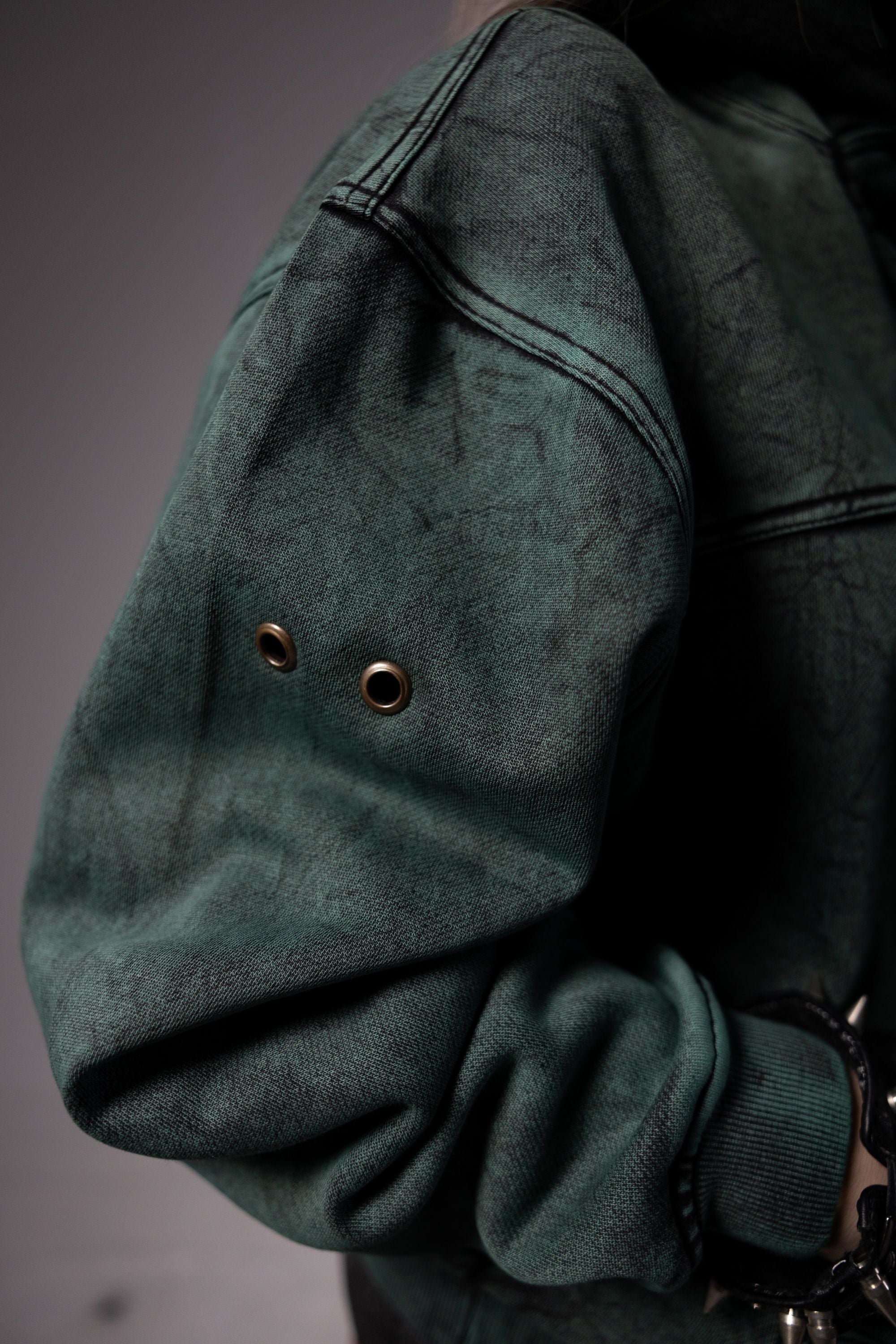 Premium fabric texture of green hoodie with soft finish and durable material