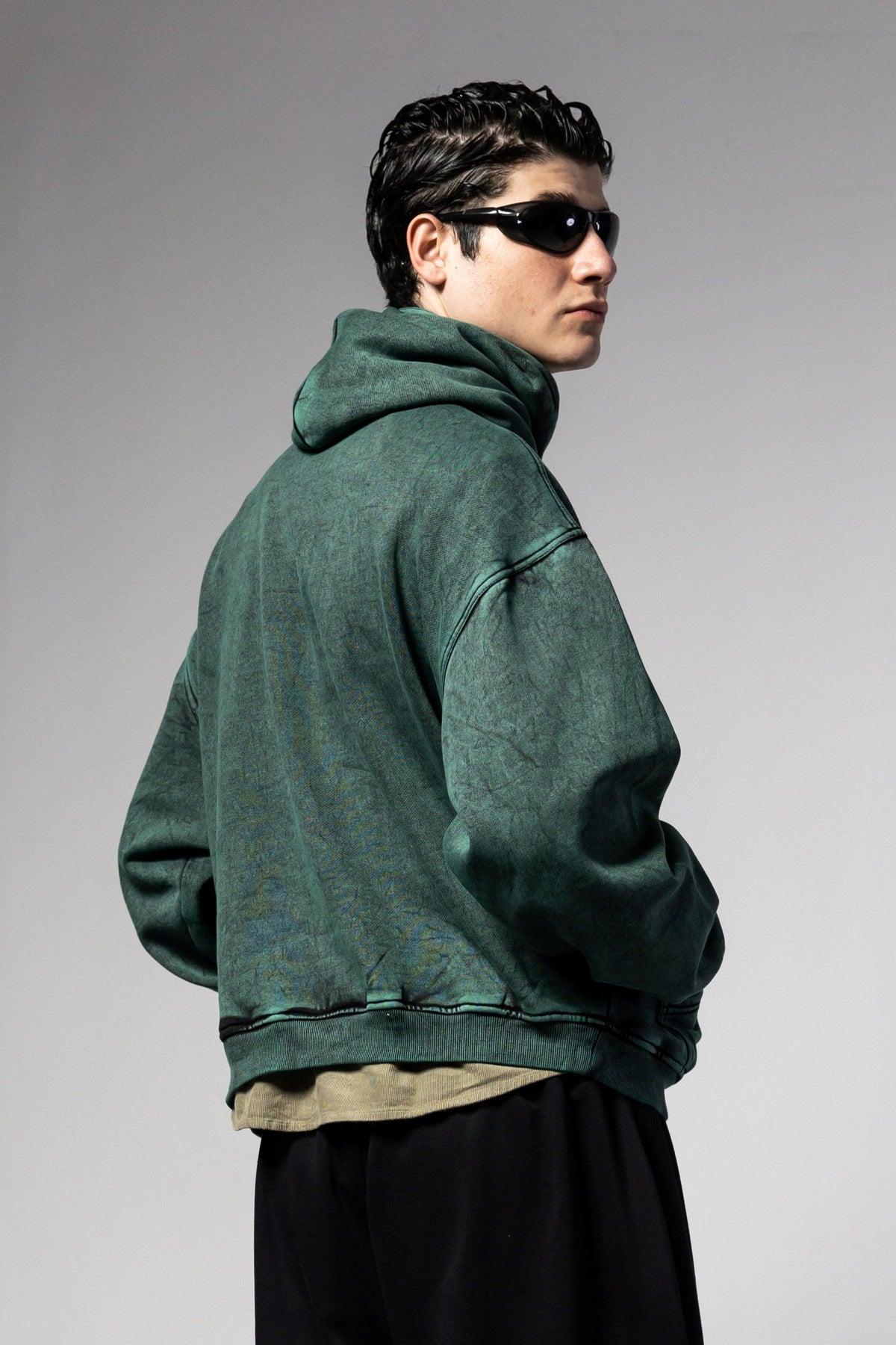 Green oversized acid washed hoodie with structured fit and contemporary streetwear silhouette