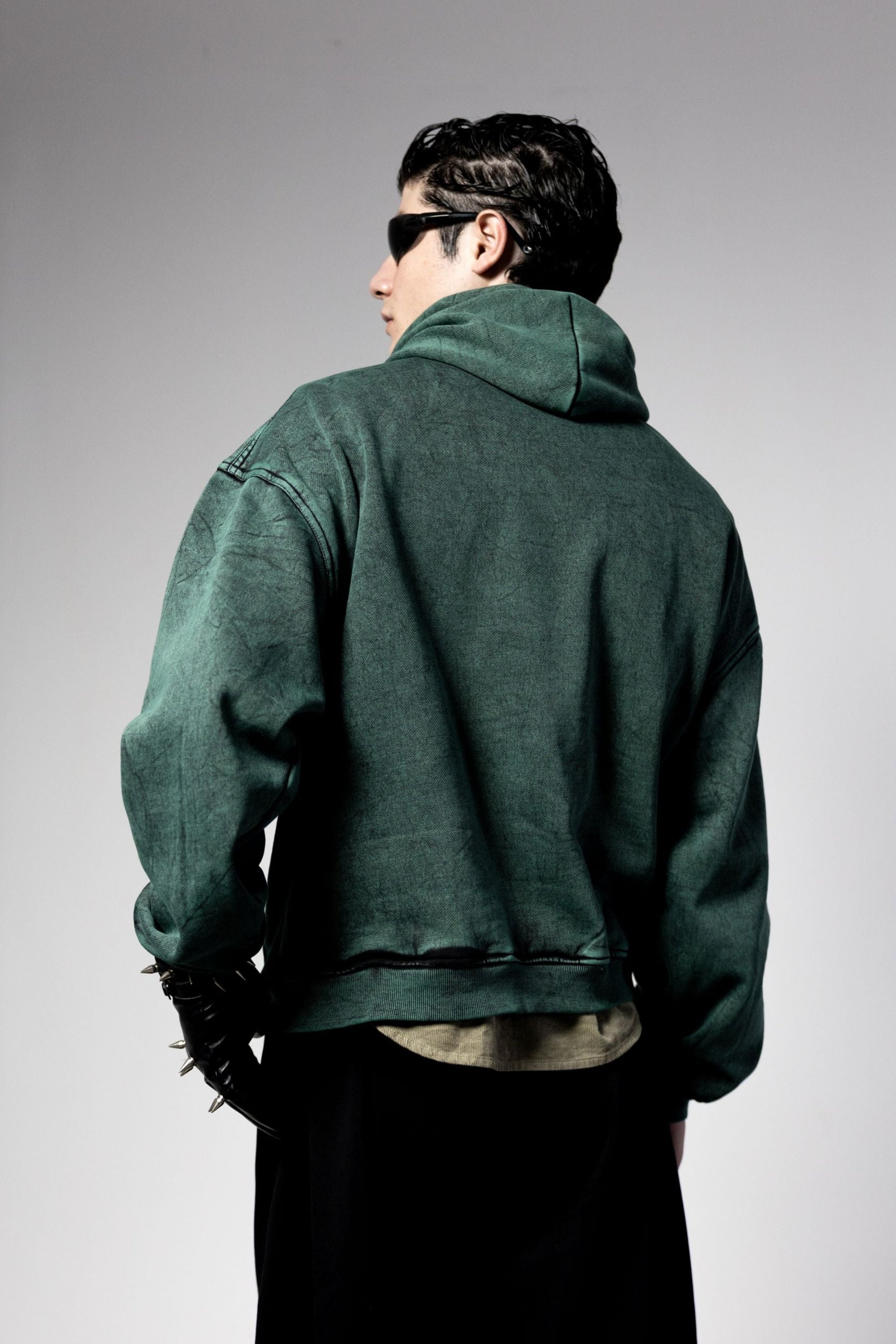 Green streetwear hoodie with clean back design and modern oversized construction