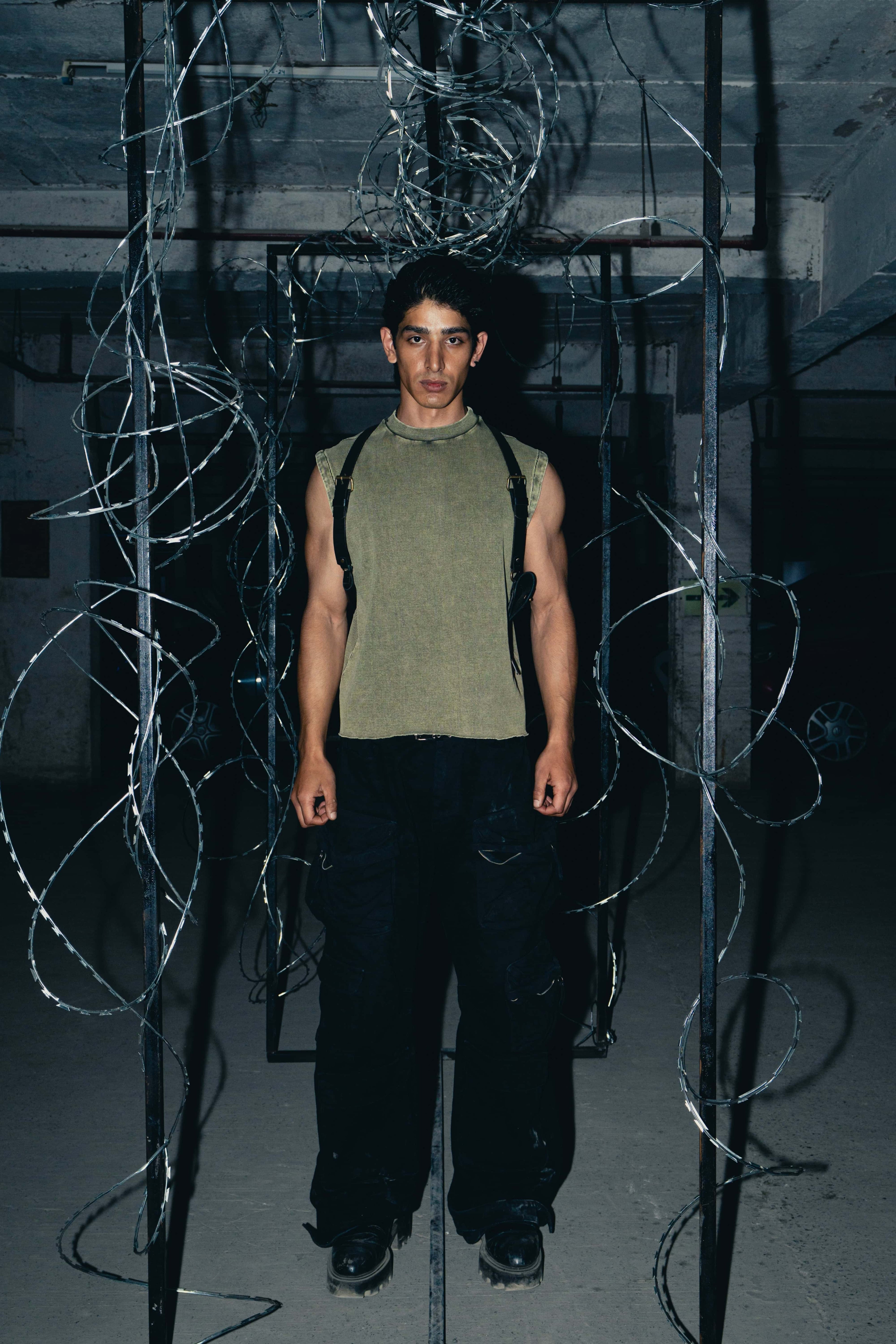 Olive green cotton premium tank top with an oversized fit, perfect for a trendy, comfortable, and street-style look