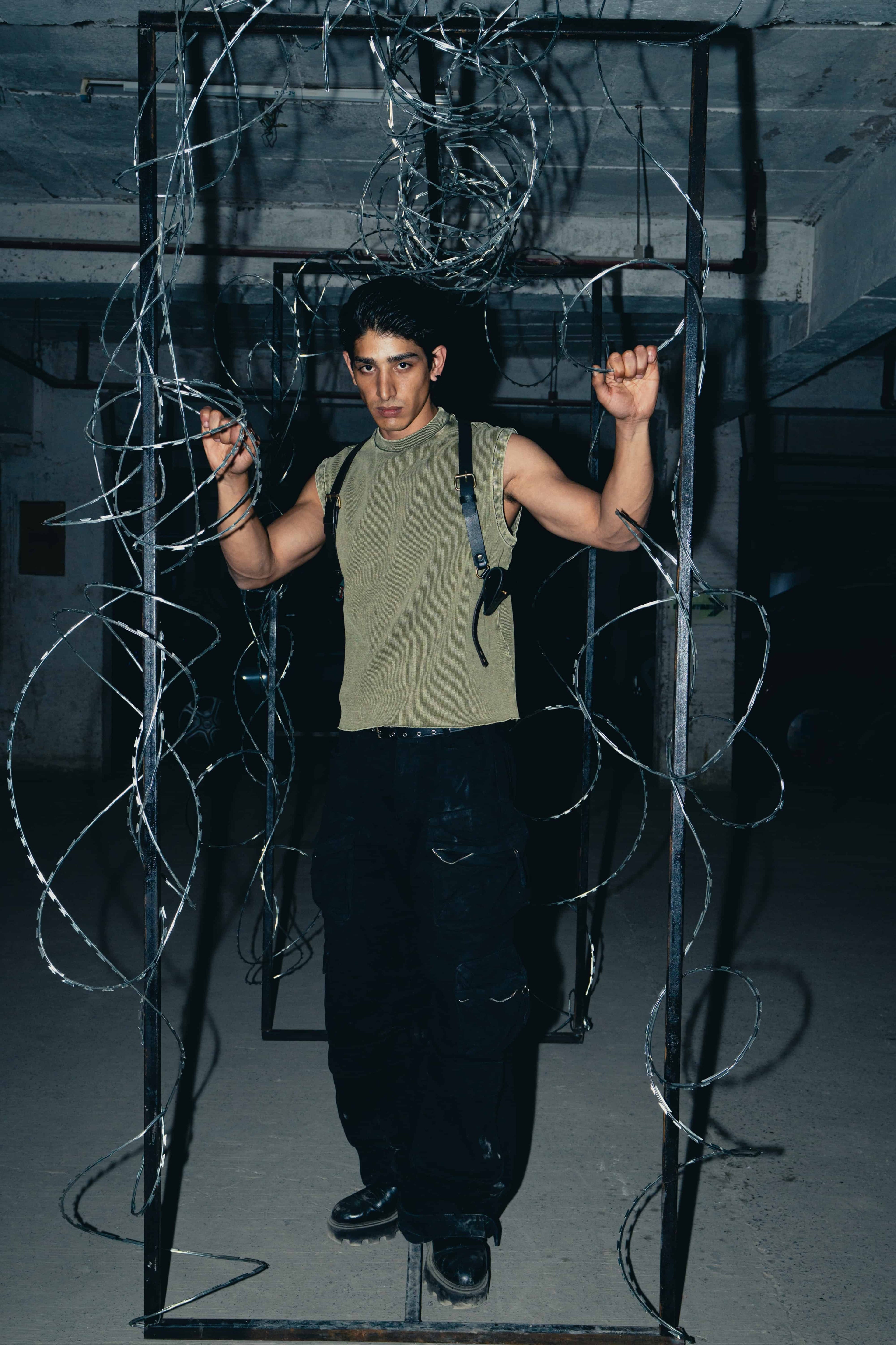 Olive green cotton tank top featuring a regular fit, offering a versatile, easy going look for casual occasions