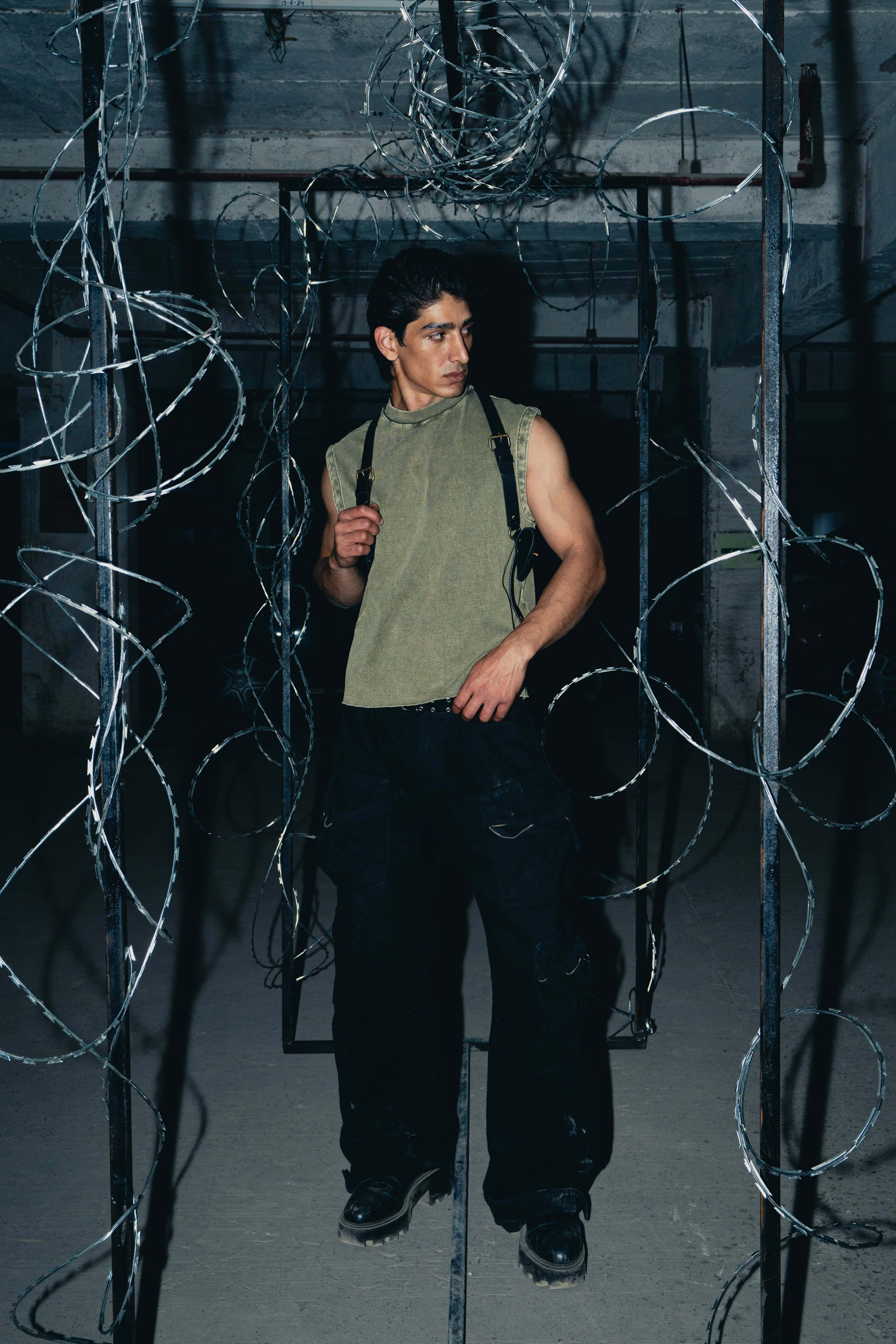 Olive green tank top crafted from cotton, featuring a trendy streetwear style, ideal for everyday fashion