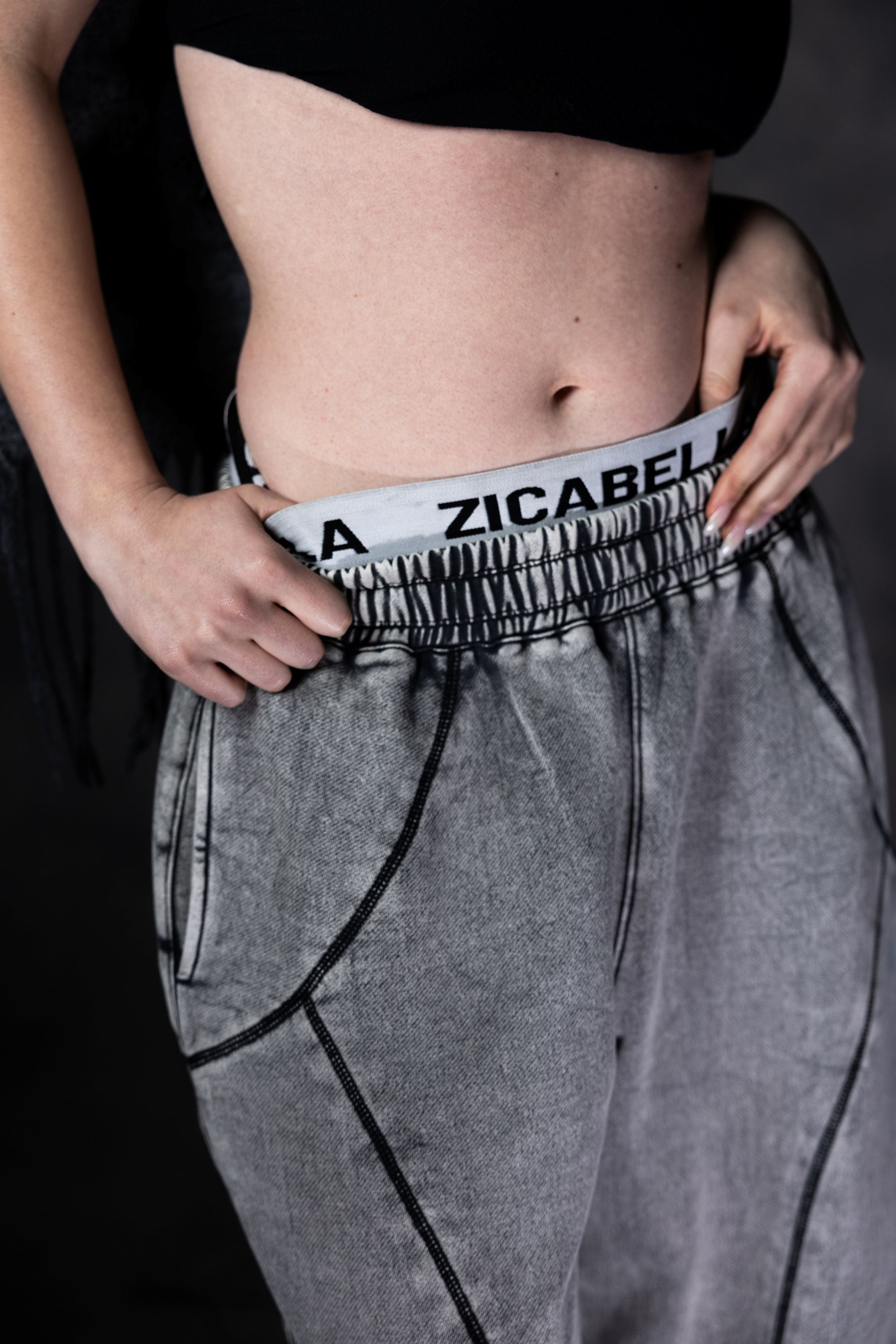 Grey baggy streetwear lower with close up detail adding edgy and modern urban look