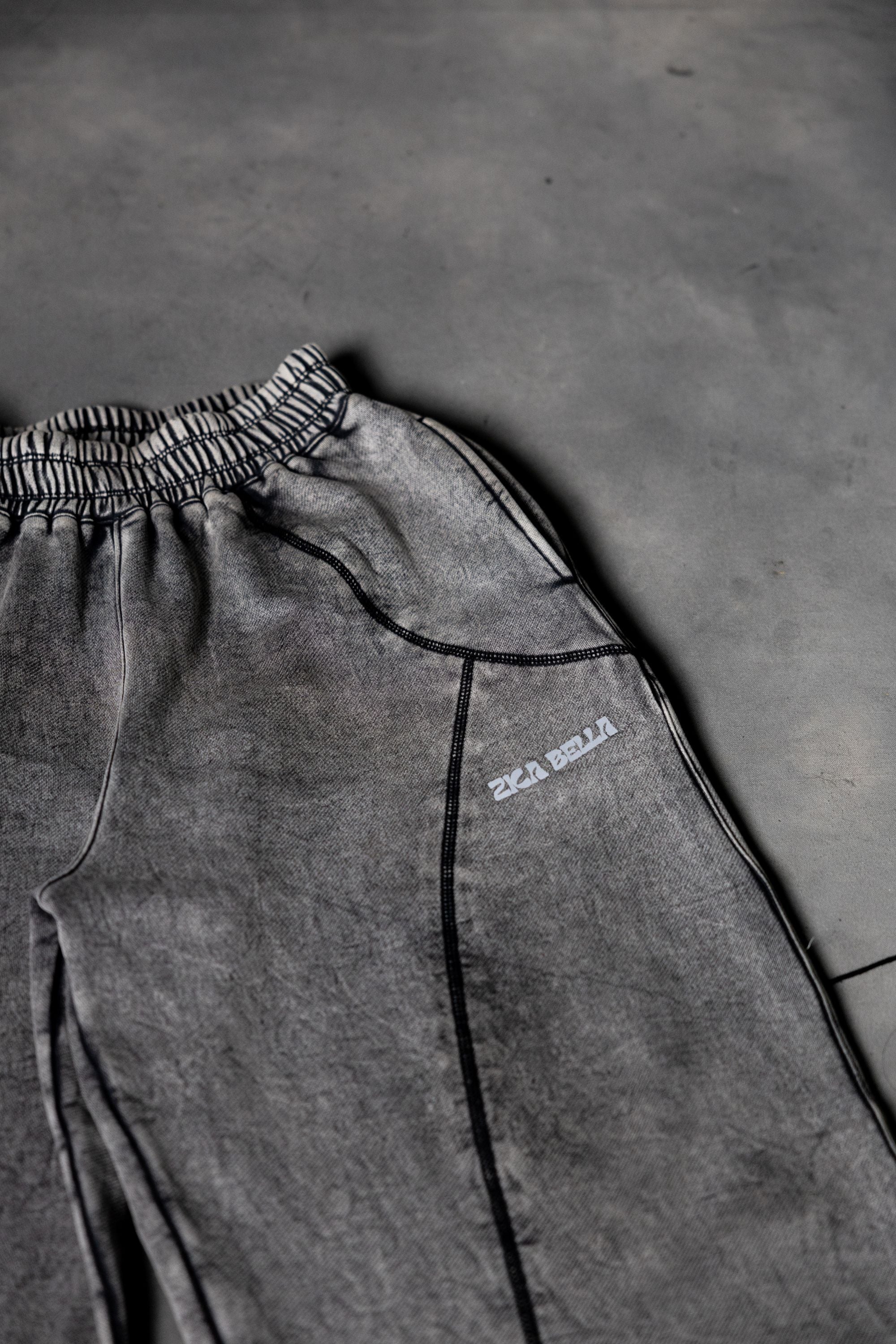 Close up stitching detail of grey baggy lower showcasing clean finish and quality build