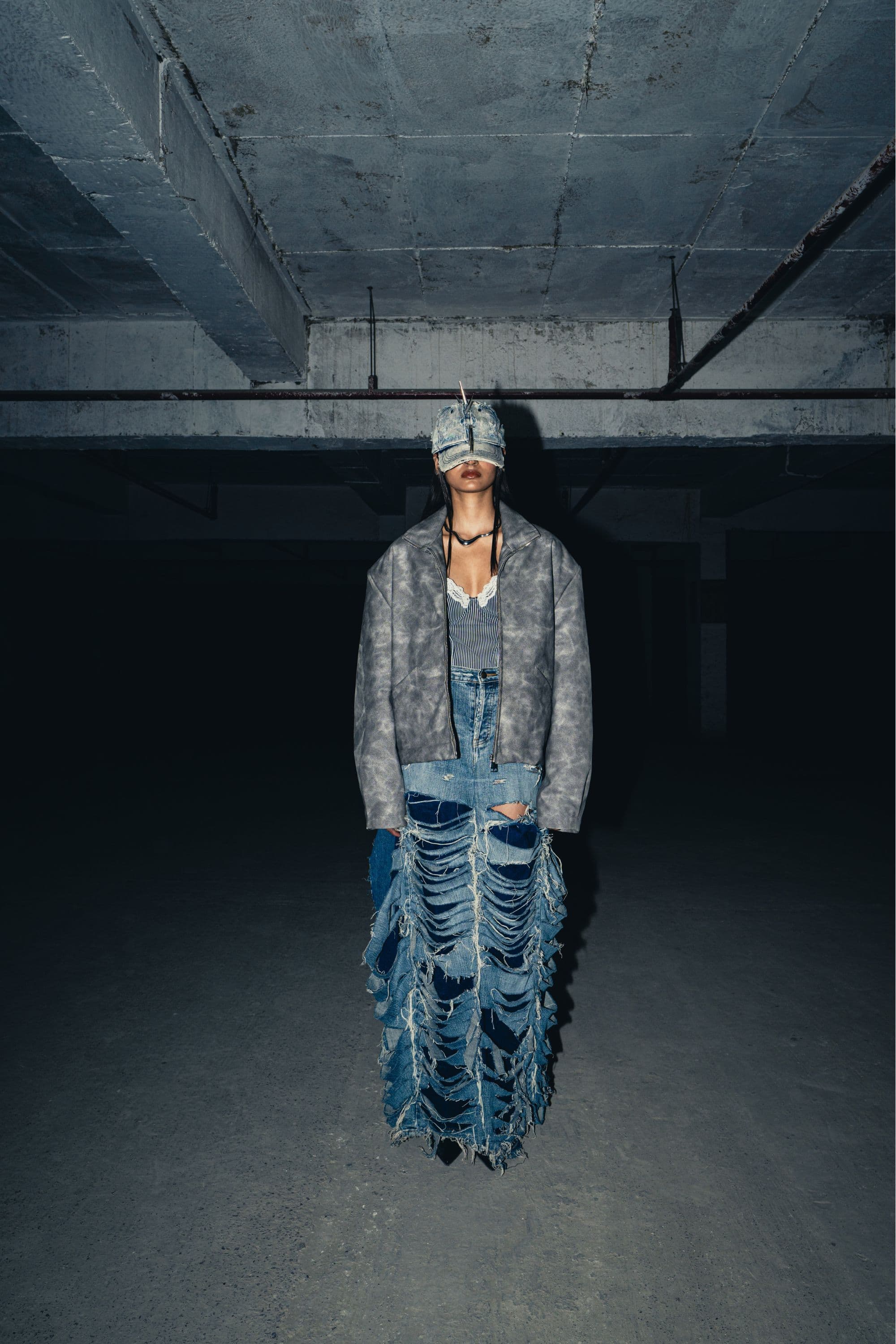 Oversized grey leather jacket made from genuine leather, designed for a cool, urban streetwear look with a relaxed fit