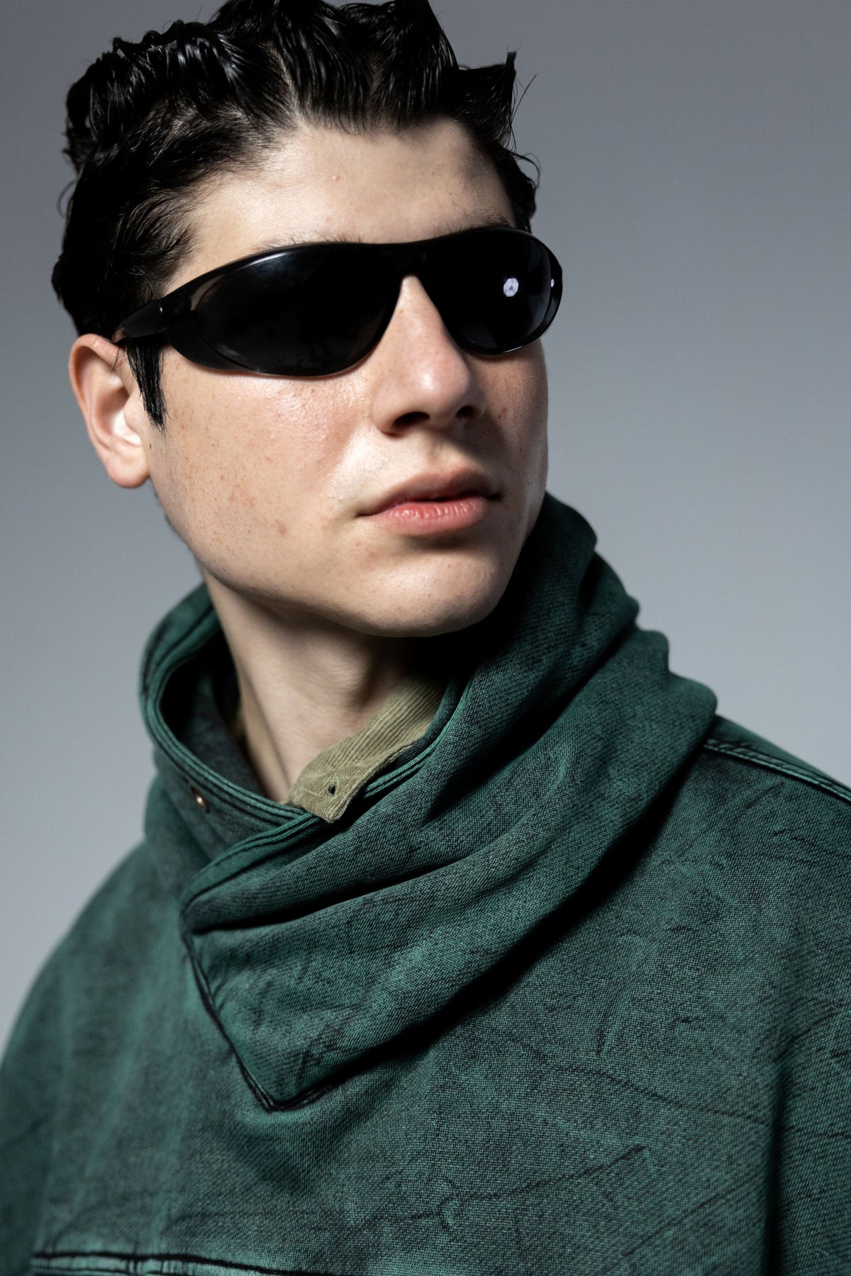 High neck green hoodie with premium stitching and modern streetwear finish