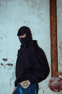 Black oversized cotton hoodie with a zipper detail for an edgy look with mask 