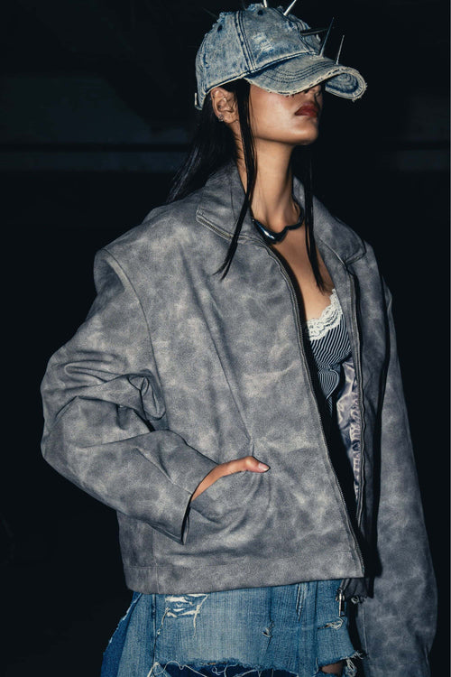 Oversized grey leather jacket made of premium leather, featuring a relaxed fit for a contemporary streetwear style