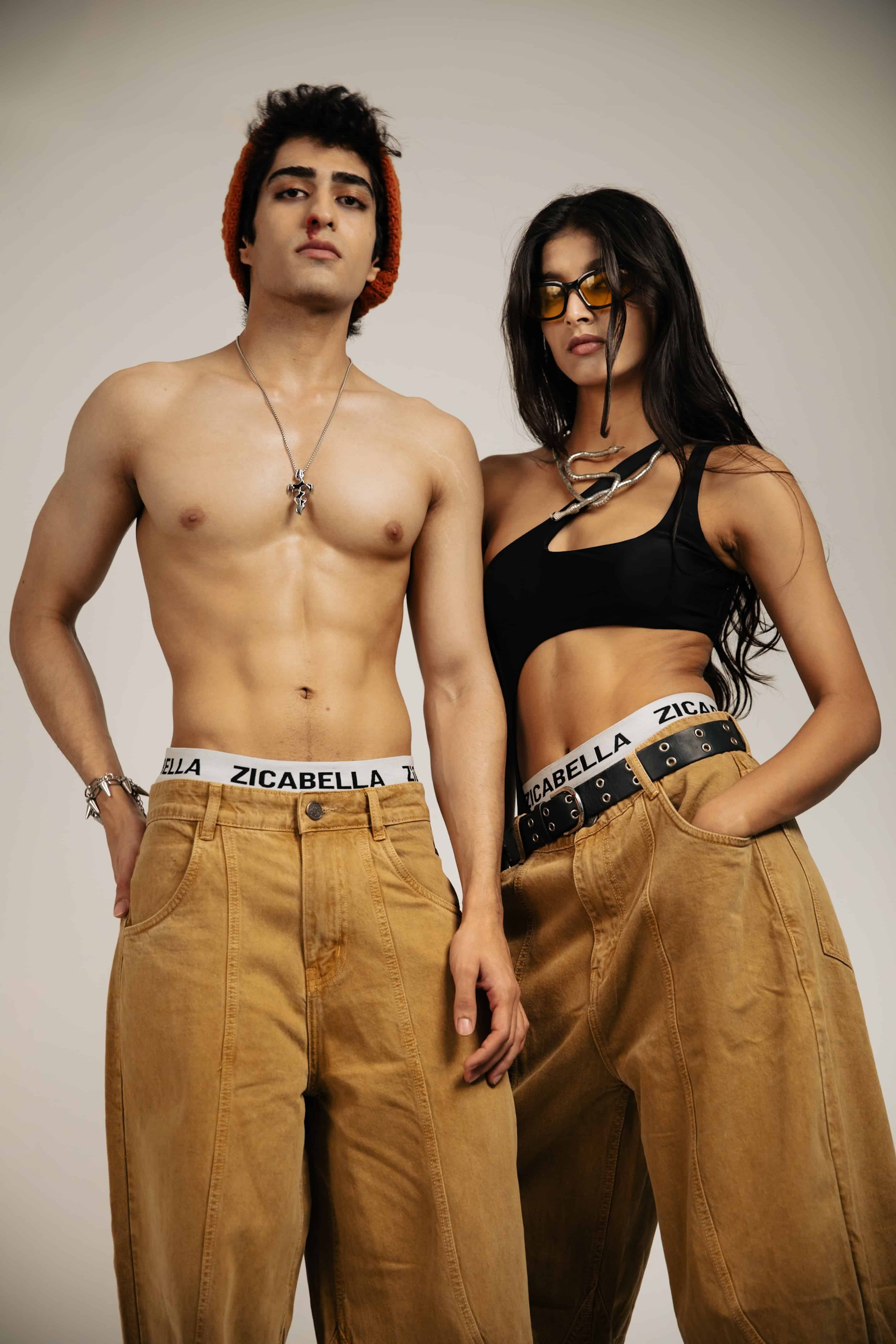 Loose fit beige cotton jeans, styled for an effortless streetwear outfit