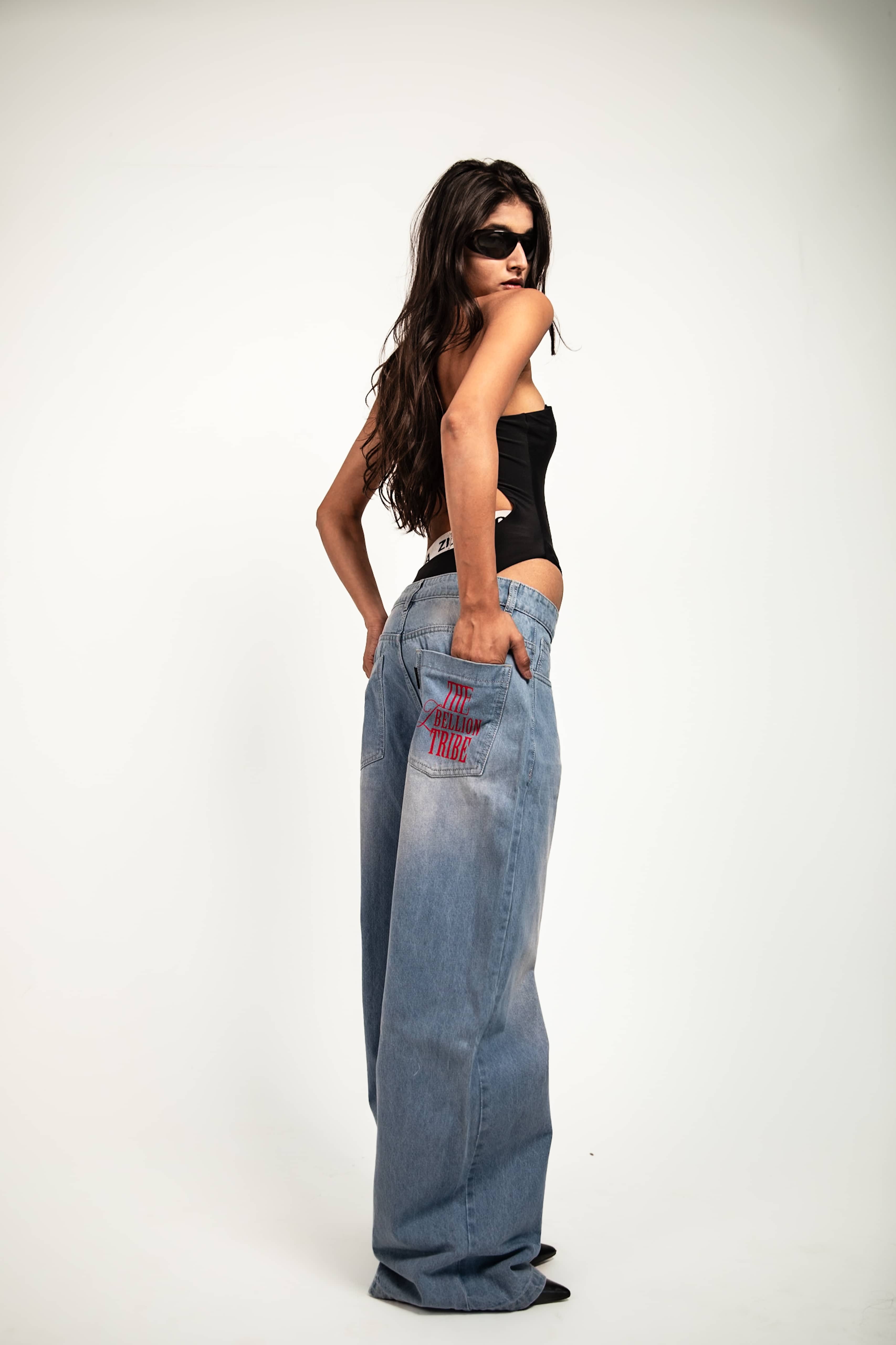 Jeans formed in denim with a relaxed fit and streetwear styling offering fluid motion and controlled oversized form