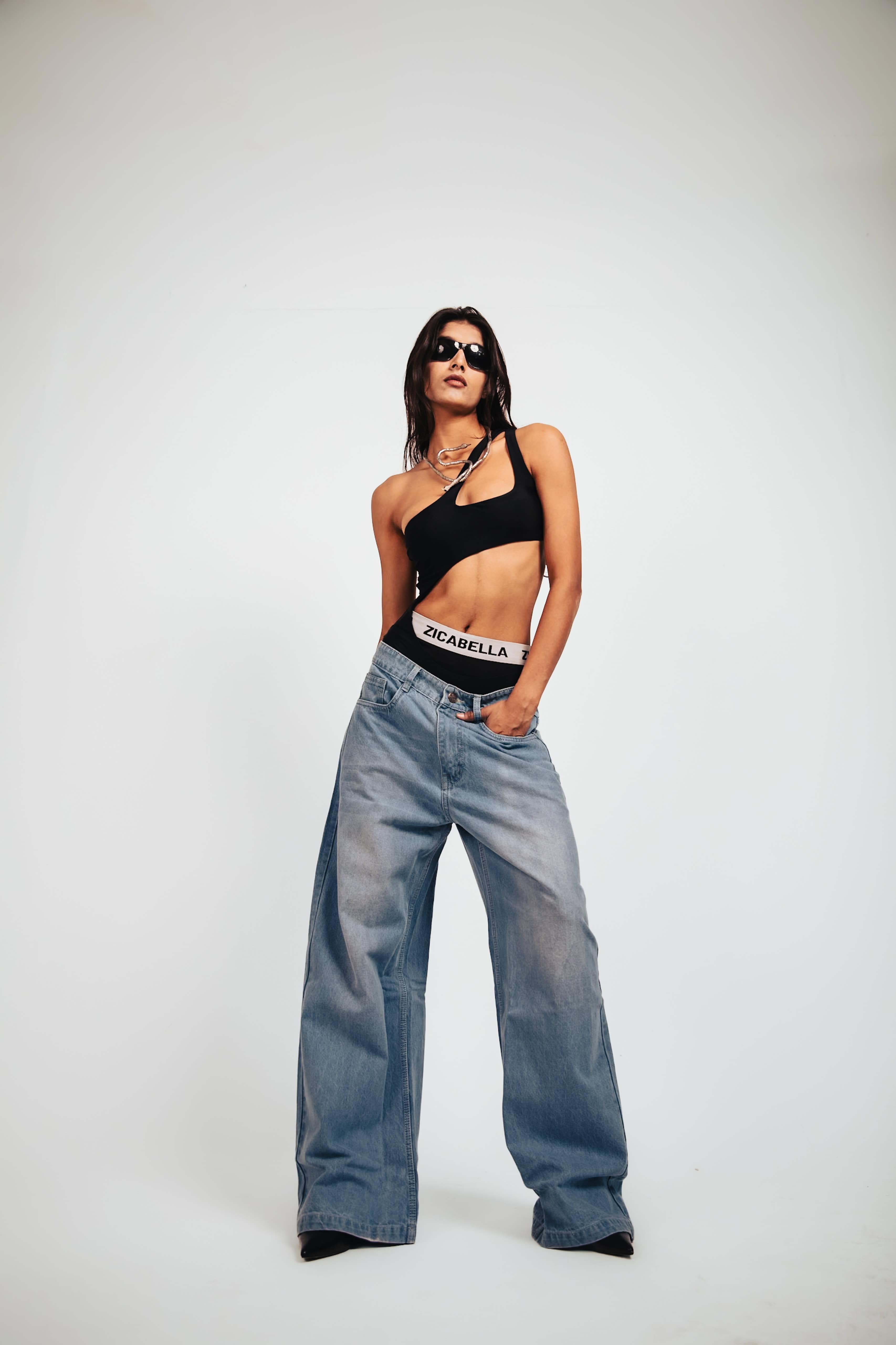 Jeans detailed in denim showcasing a textured finish with premium drape and defined oversized construction