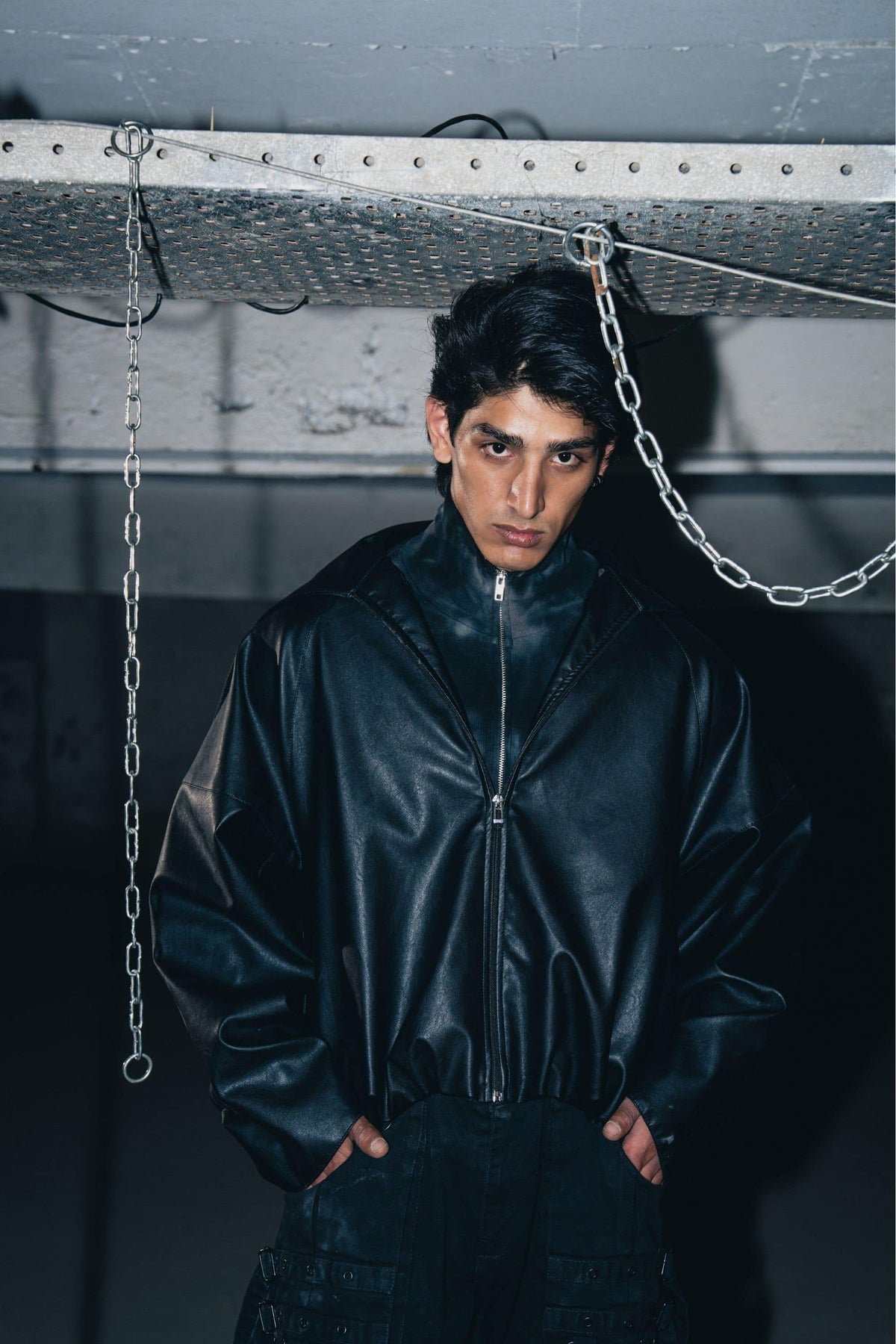 Luxury black leather biker jacket with structured design, crafted from premium leather for a tailored fit.