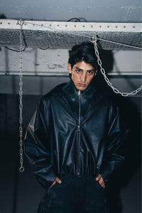 Luxury black leather biker jacket with structured design, crafted from premium leather for a tailored fit.