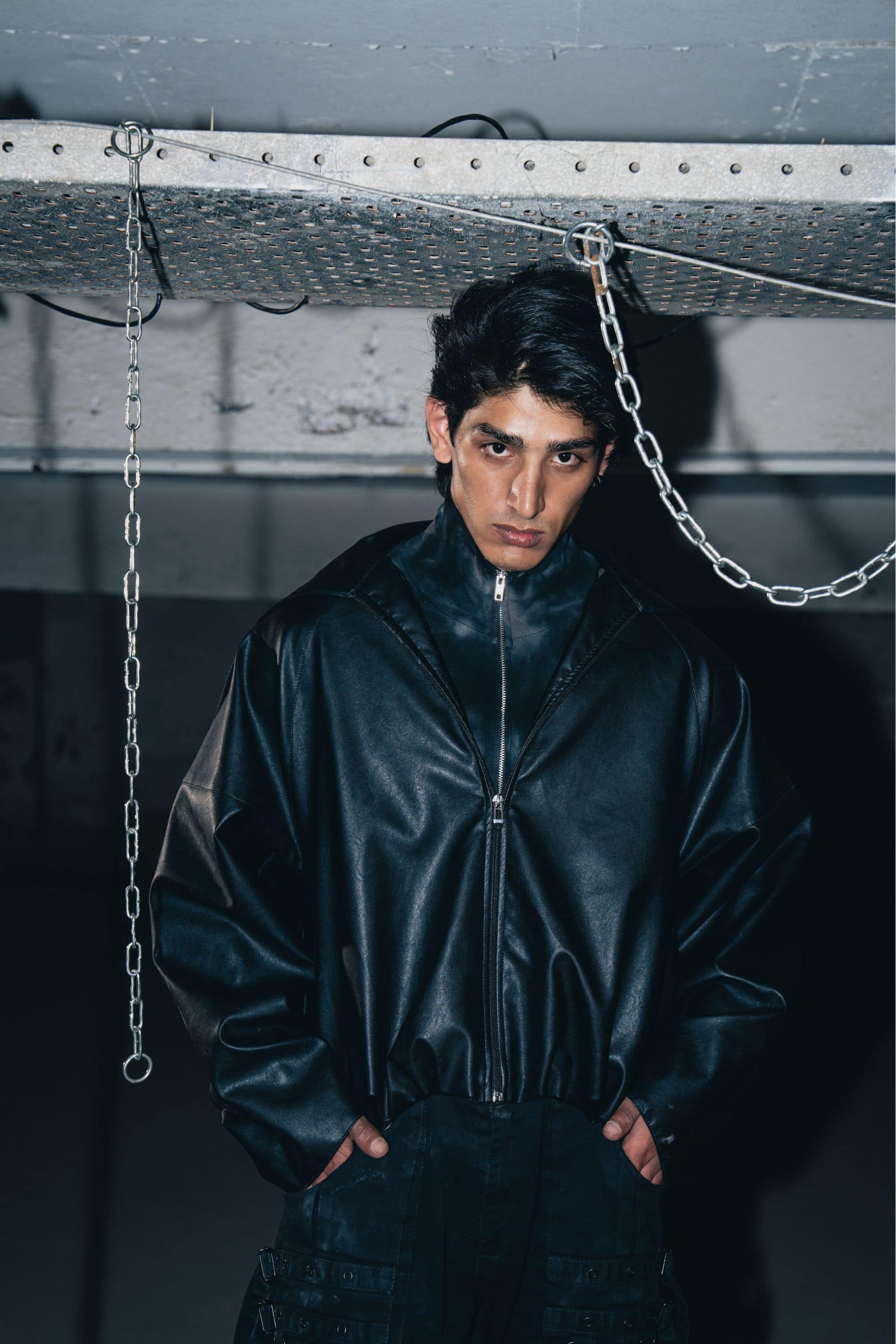 Luxury black leather biker jacket with structured design, crafted from premium leather for a tailored fit.