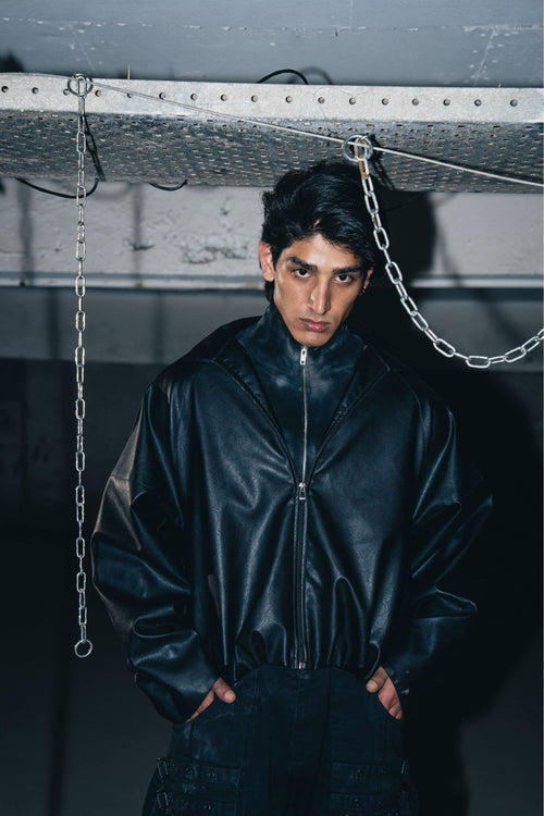 Luxury black leather biker jacket with structured design, crafted from premium leather for a tailored fit.