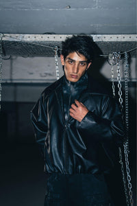 Premium cotton and leather blend jacket in black, offering a relaxed fit with a stylish biker cut.