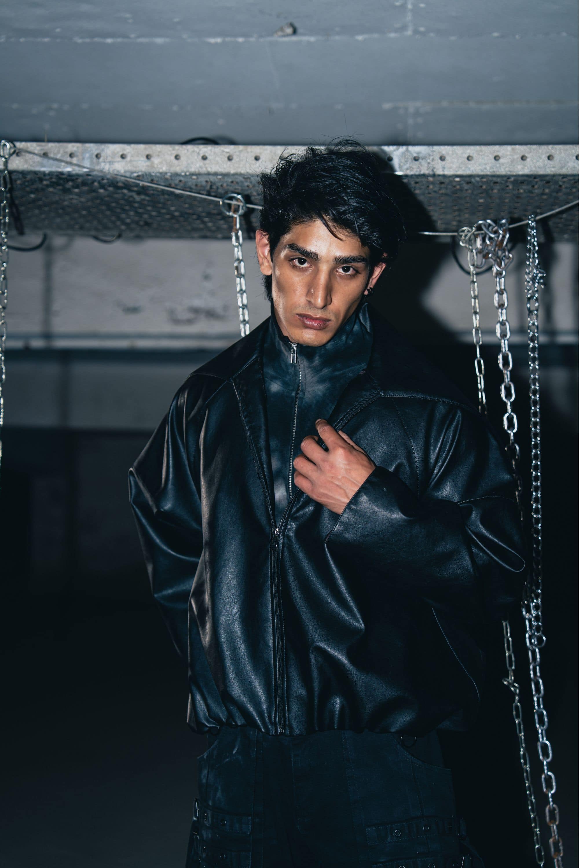 Premium cotton and leather blend jacket in black, offering a relaxed fit with a stylish biker cut.