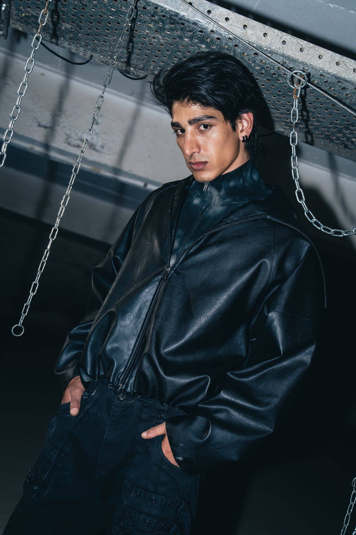 Premium textured black leather biker jacket, offering a relaxed fit with bold, sleek design