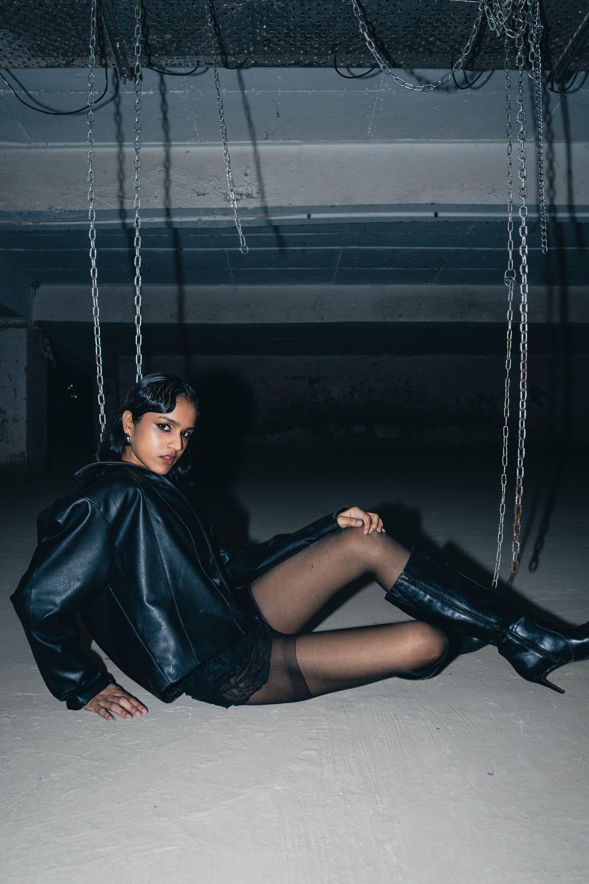 Streetwear-inspired black leather biker jacket with a baggy fit, designed for a bold and stylish look