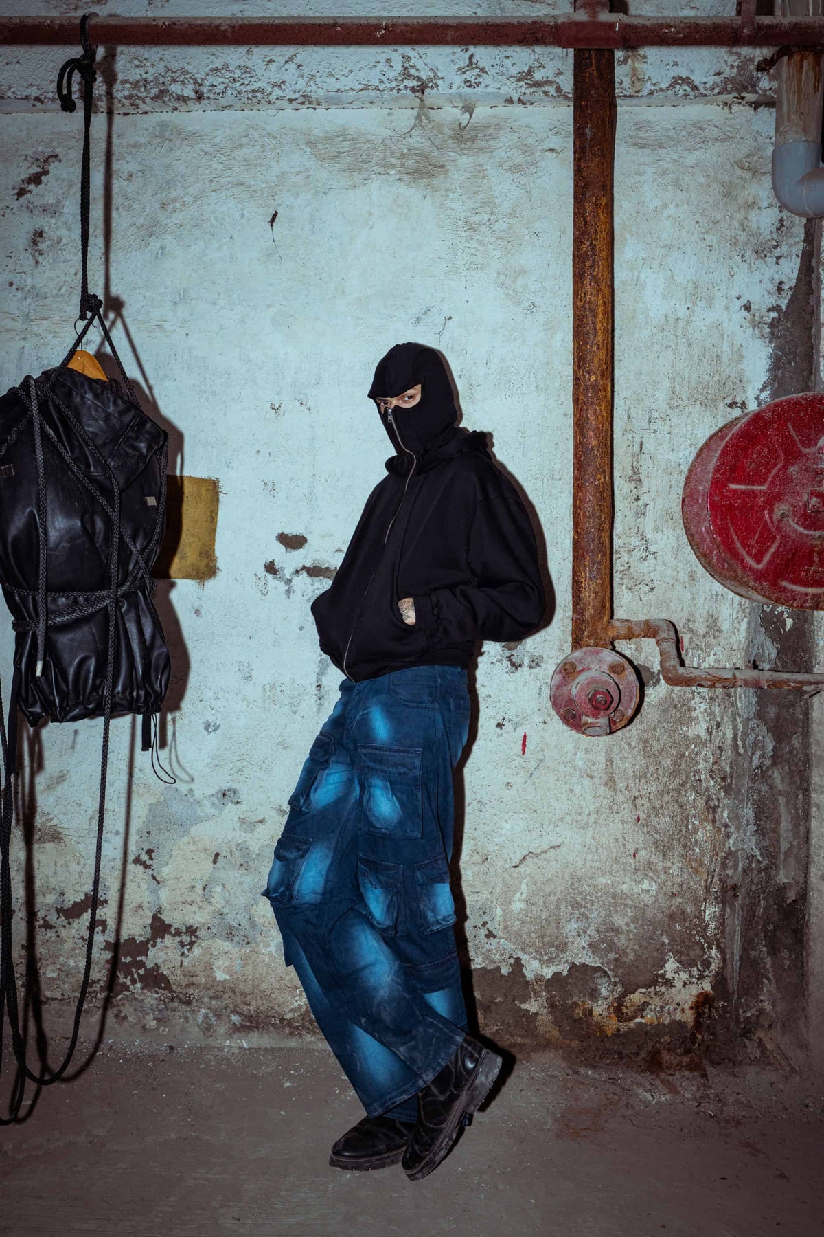 Luxe black cotton hoodie with a loose fit, tailored for a modern urban streetwear aesthetic